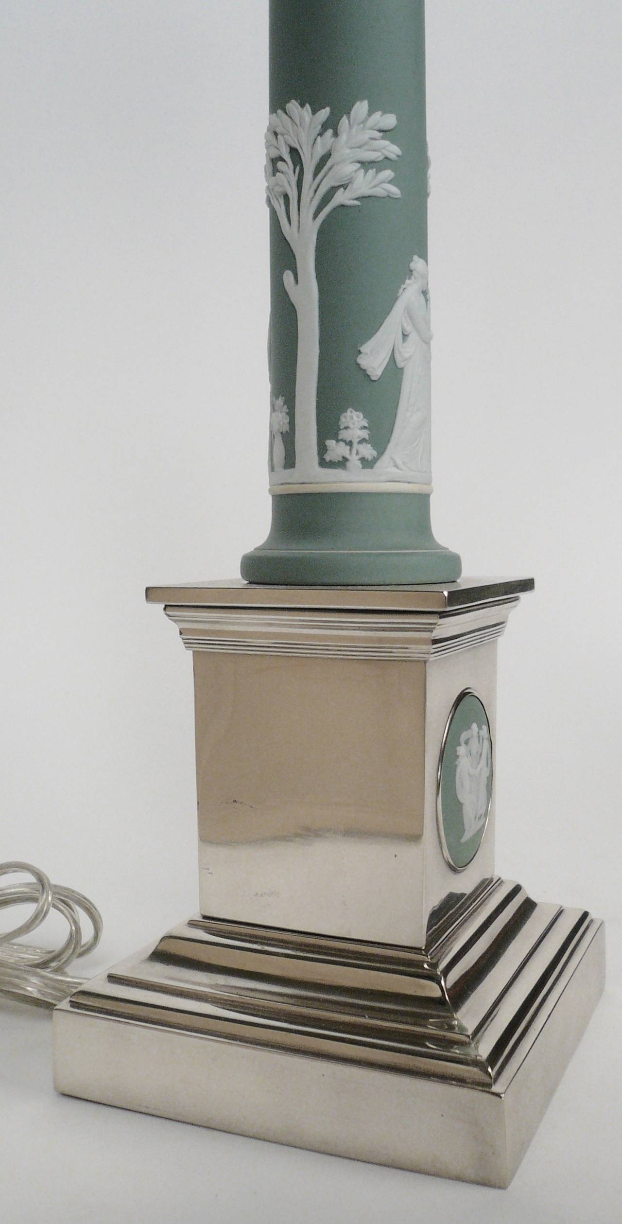 Silver plate, and green Wedgwood jasper ware columnar form lamp, with a stepped plinth base, inset with a jasper ware medallion.