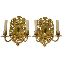 Pair of Edward F. Caldwell Old English Style Two-Light Gilt Bronze Sconces