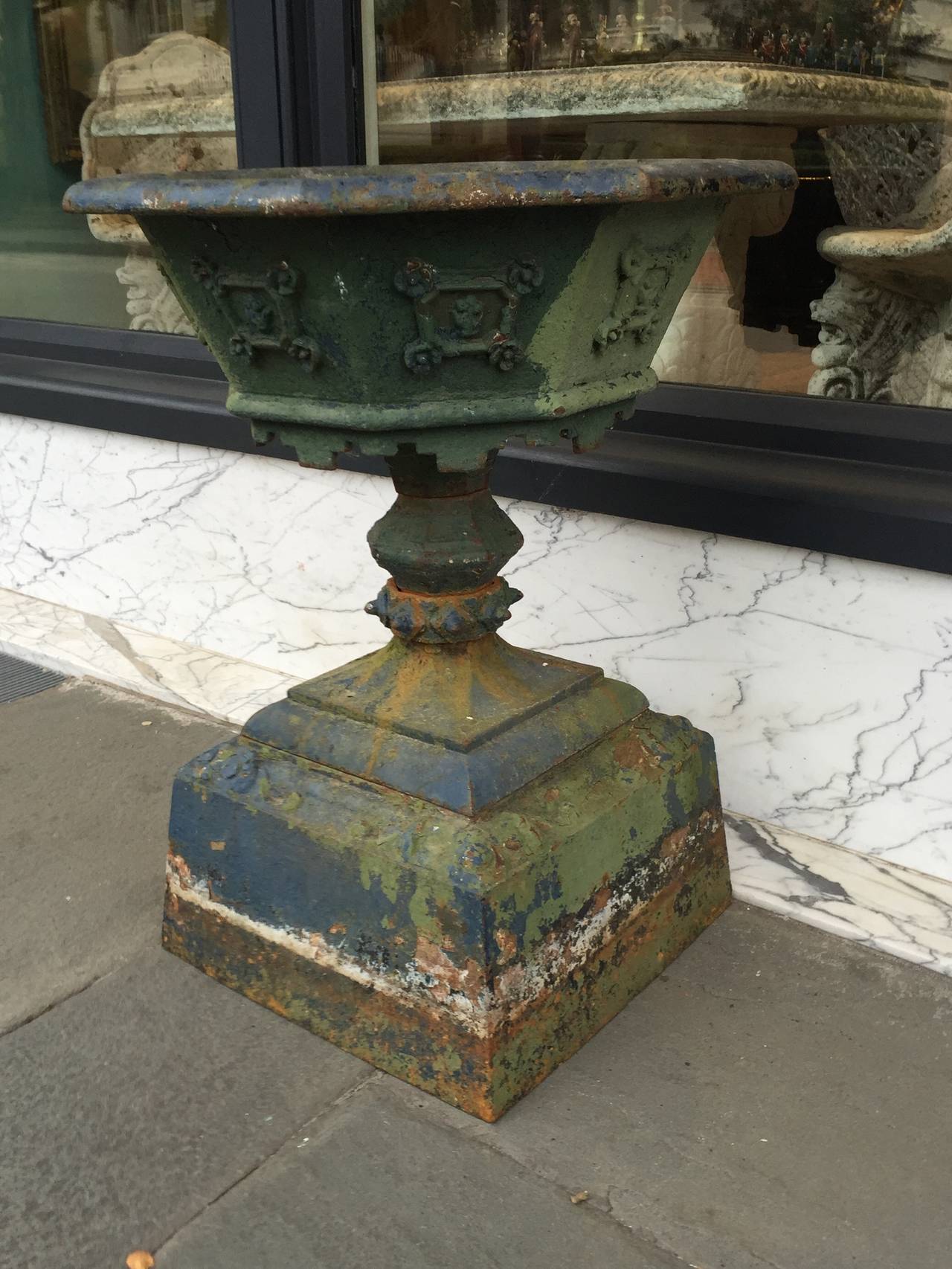Single cast iron urn with octagonal shaped top consisting of a top and bottom base from the late 19th century
