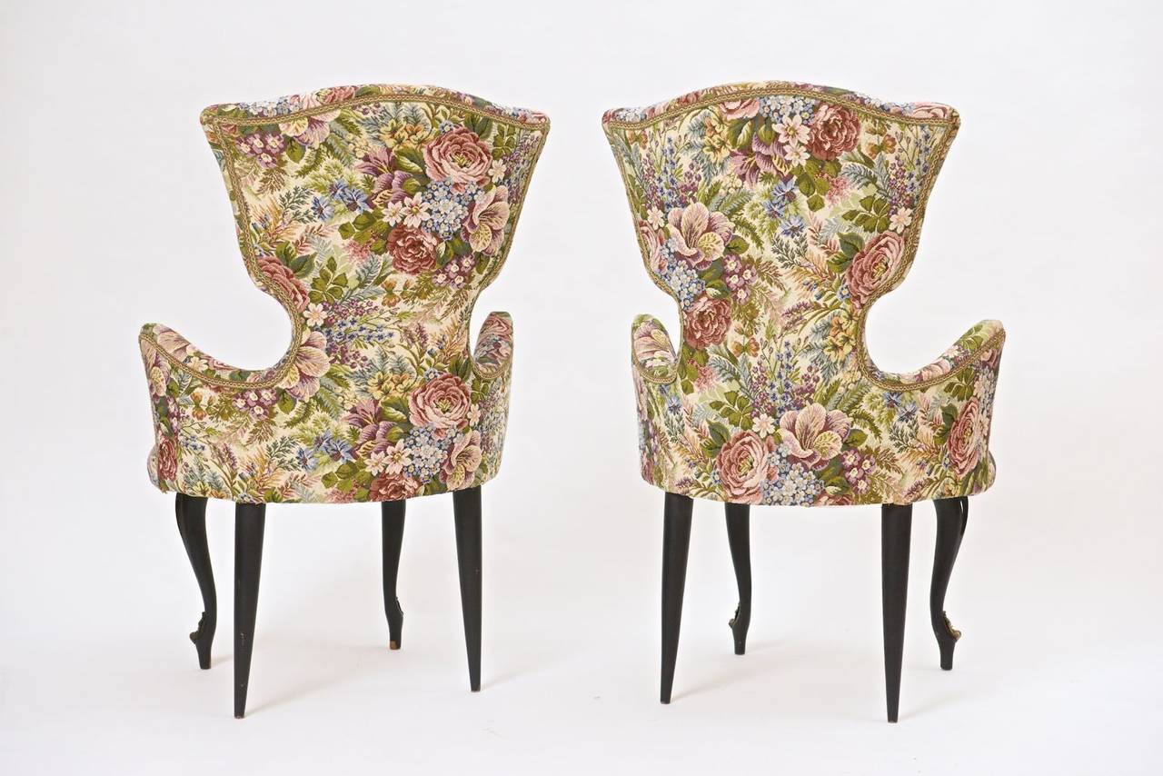 Pair of Italian chairs with leg detail in brass.