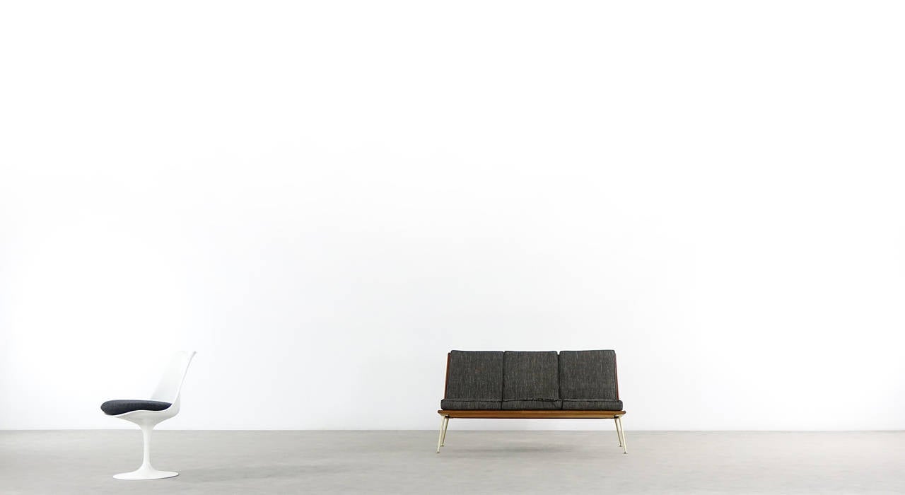 One Hans Mitzlaff & Albrecht Lange three-seat sofa for Eugen Schmidt Soloform, 1953.

The wooden frame and feet are in great condition, the original cushions show traces of use.