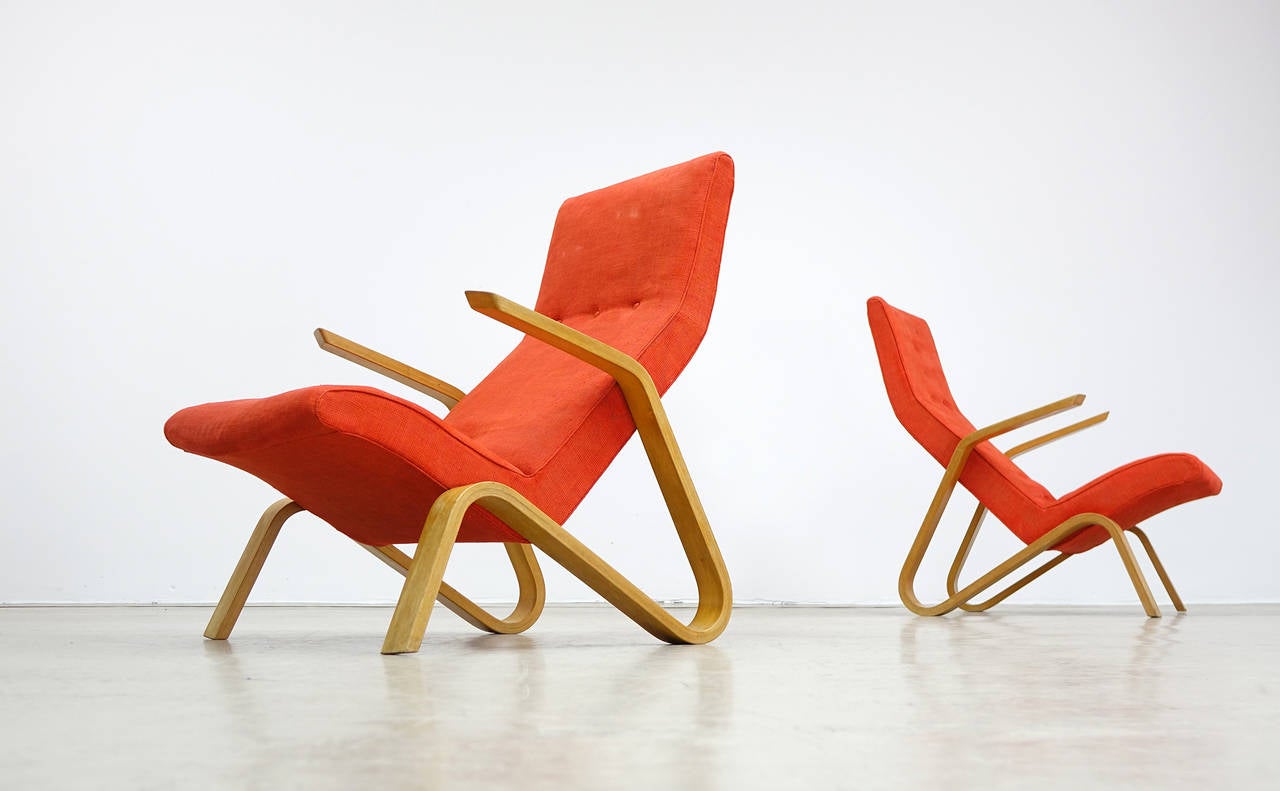 Eero Saarinen for Knoll International, 1946. 

Legendary grasshopper easy chair (one of two).
Plywood parts are in very good condition, early Knoll International label.
The orange-red fabric is of origin and in nearby perfect cond. the