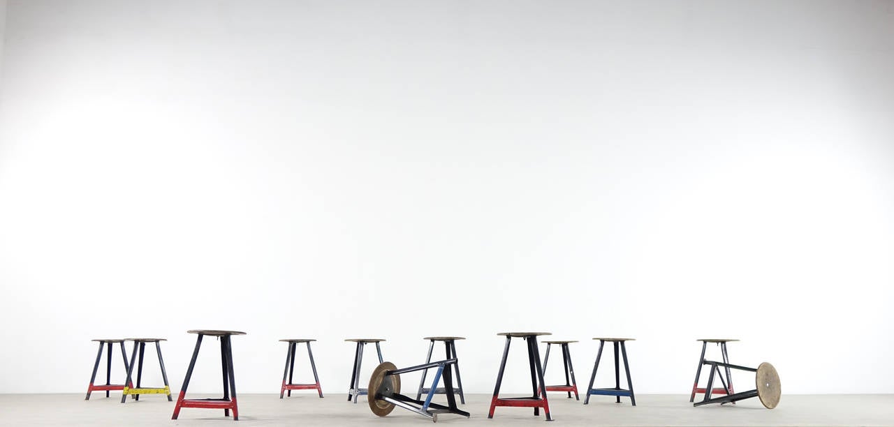 12x bauhaus workshop stools ... coming from berlin, germany

tripod stand in steel - wooden top, very nice patina
(price is for all 12 pieces..)