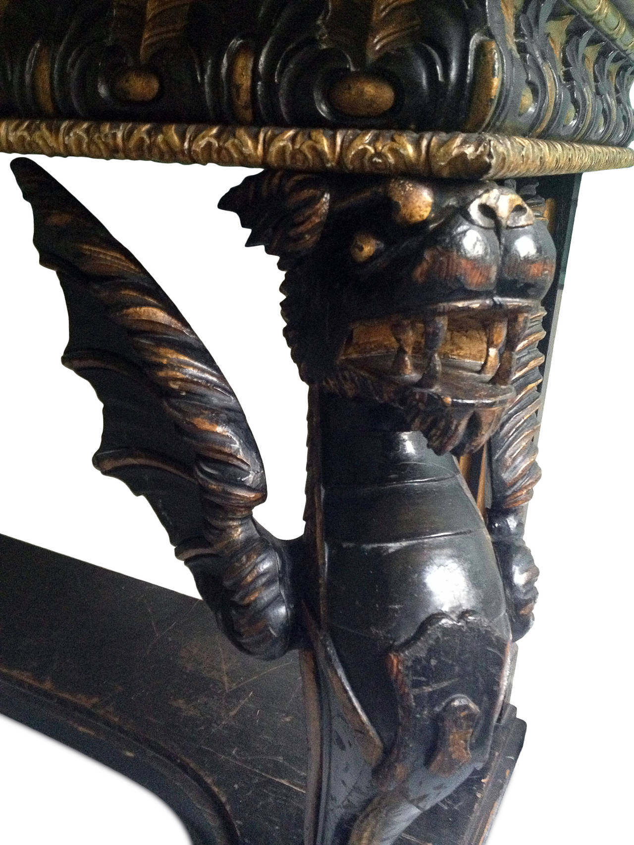 Painted and gilt Italian console table, beautifully sculpted and decorated with winged dragons. Top made of giallo antico marble.