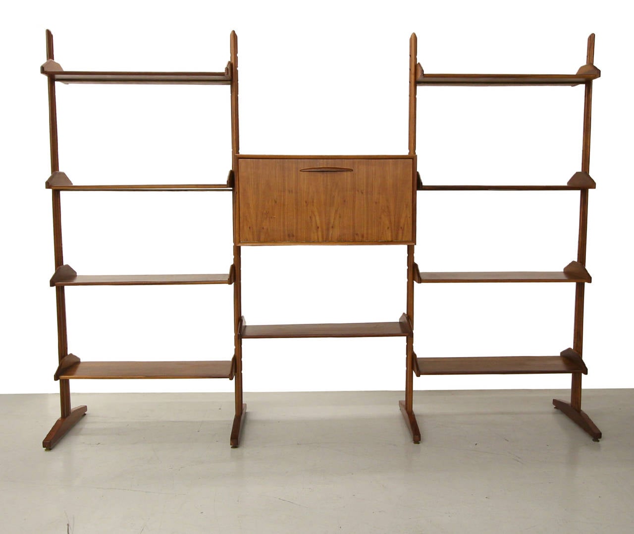 This is the most amazing solid walnut room divider shelving unit. The unit features ten solid walnut shelves (1 not pictured), one box unit and four standing supports. Under every shelf and box is a brass rod and the adjustable feet are also brass.