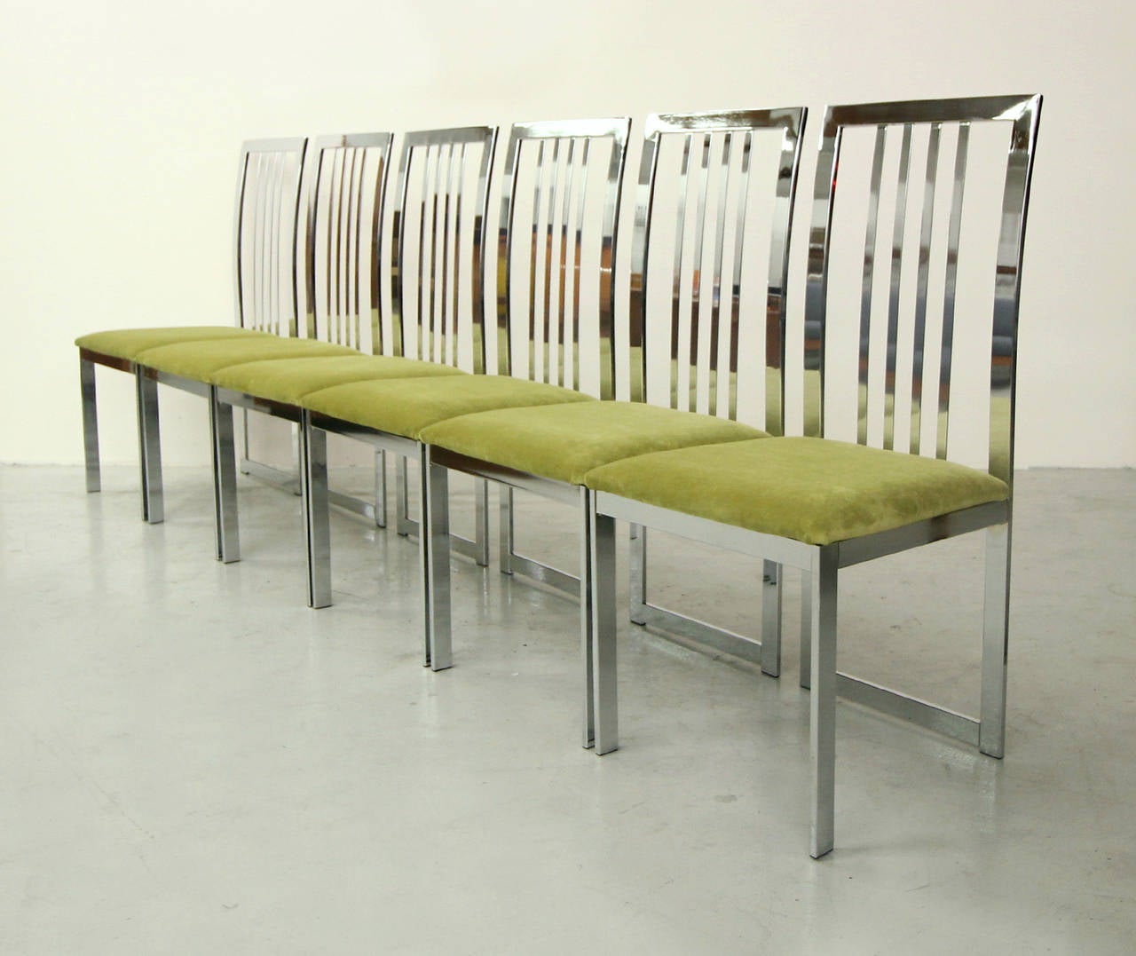 Exquisite set of 6 all chrome dining chairs designed by Milo Baughman for Design Institute America (DIA).  Mirrored chrome, Rare, Modern beauties.  Newly upholstered.

Manufactured in July 1993