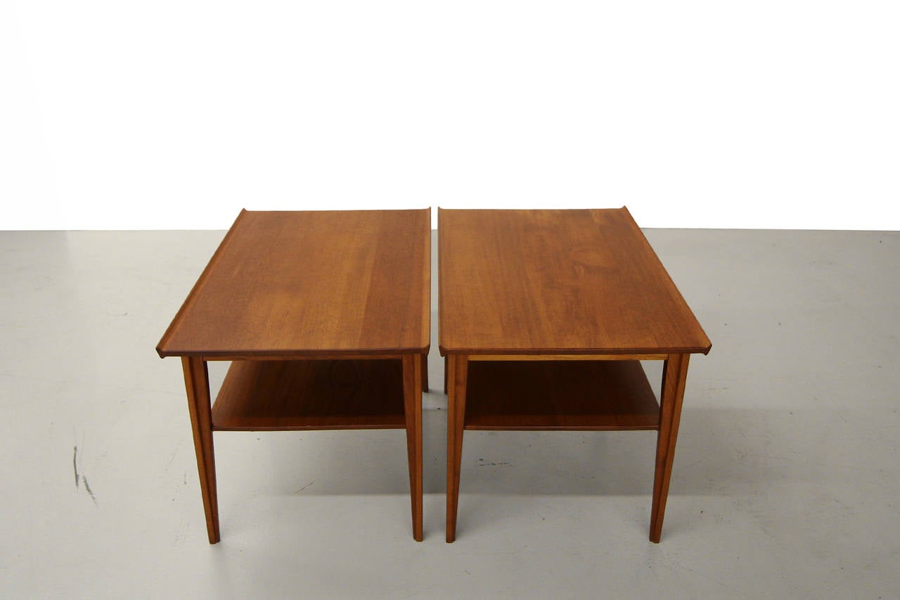 Pair of 500 Series Danish Teak Tiered Side tables by Finn Juhl for France and Son.  Tables are RARE solid teak.  Sleek design, perfect Danish details and construction.