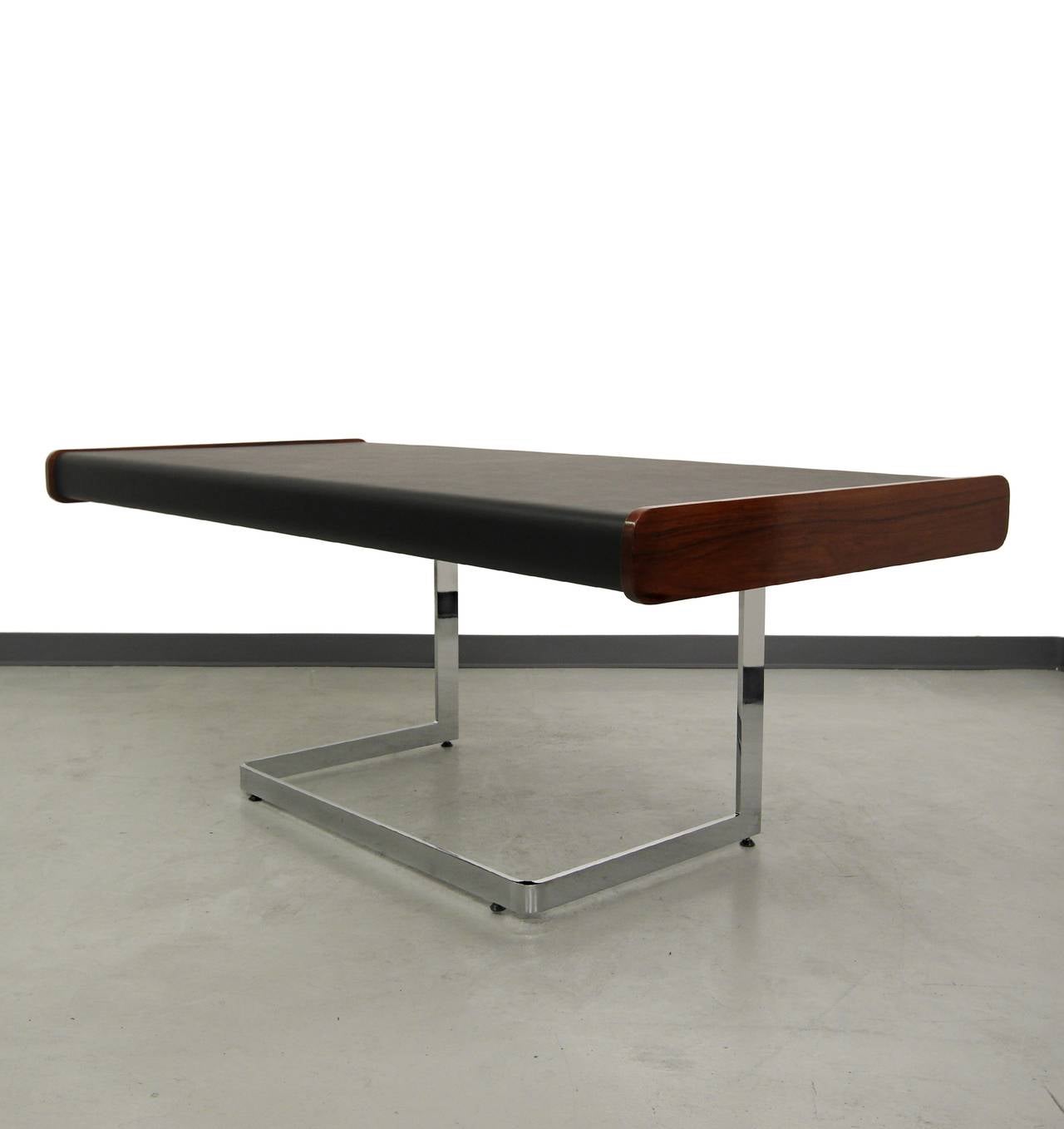 Absolutely gorgeous Rosewood and Chrome Executive Desk by Ste-Marie & Laurent of Canada.  Desk features beautiful rosewood grain, spotless chrome frame and mint condition black writing surface.  Spruce up your work space with this classy, minimalist