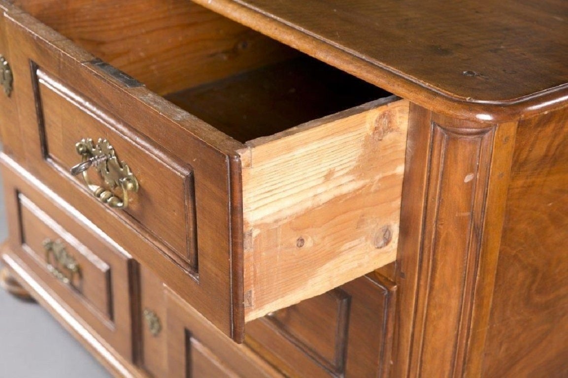 Carved 18th Century Continental Four-Drawer Walnut Commode For Sale