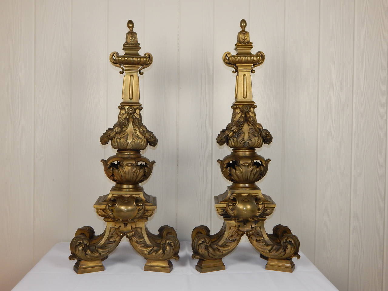 Extremely fine pair of large bronze chenets in the style of Louis XVI. Both chenets are stamped "MADE IN FRANCE and Lescurieux, PARIS.
The quality and detail of the casting on these is truly exceptional.