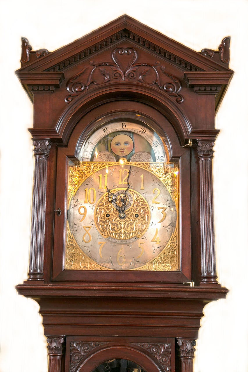 A nice classical carved mahogany grandfather clock, with three weights, and pendulum engraved with initials, and dated 1895. The fine movement is an eight day clock, and also strikes the hour and the half hour on a coiled gong. Having a lovely hand