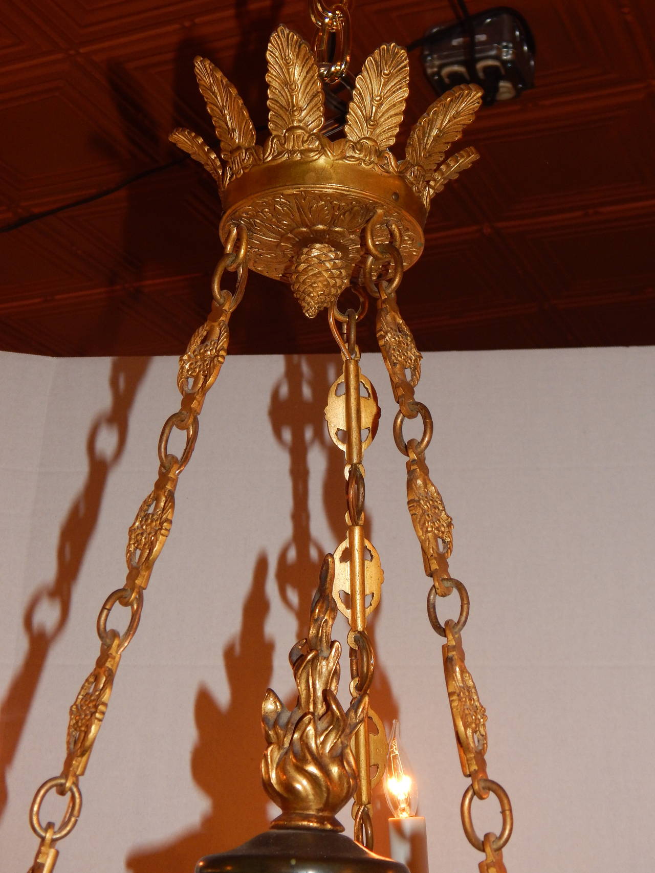 Good quality Empire style two tone bronze six light chandelier, with swans.