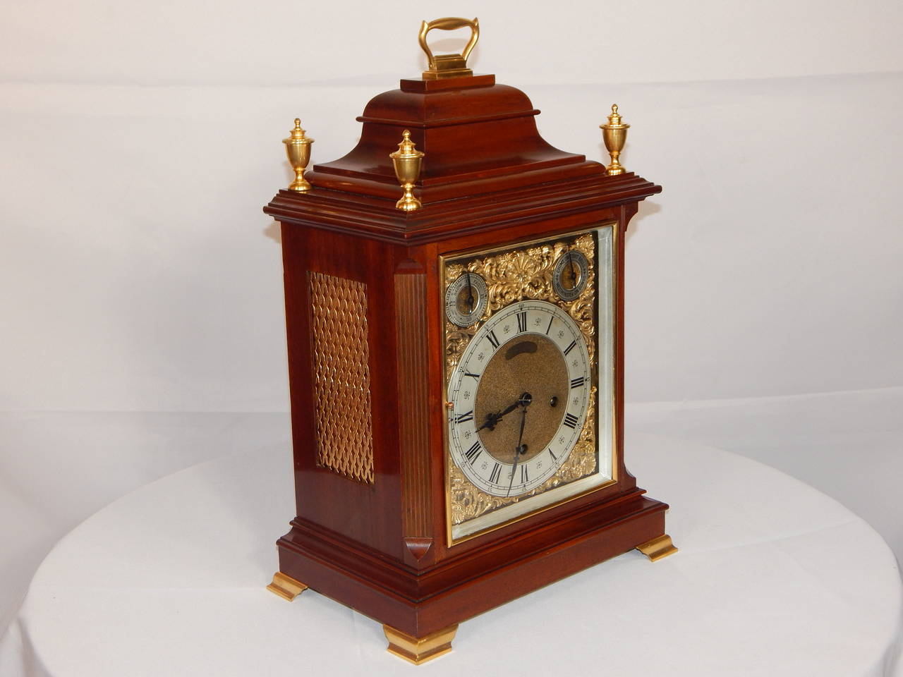 Every quarter hour this clock strikes on the sweetest rack of bells or if you prefer, gongs! It sounds just like a finely tuned music box.
The clock is in running condition. German made, with a Belgian retailer's
label on the dial, the movement