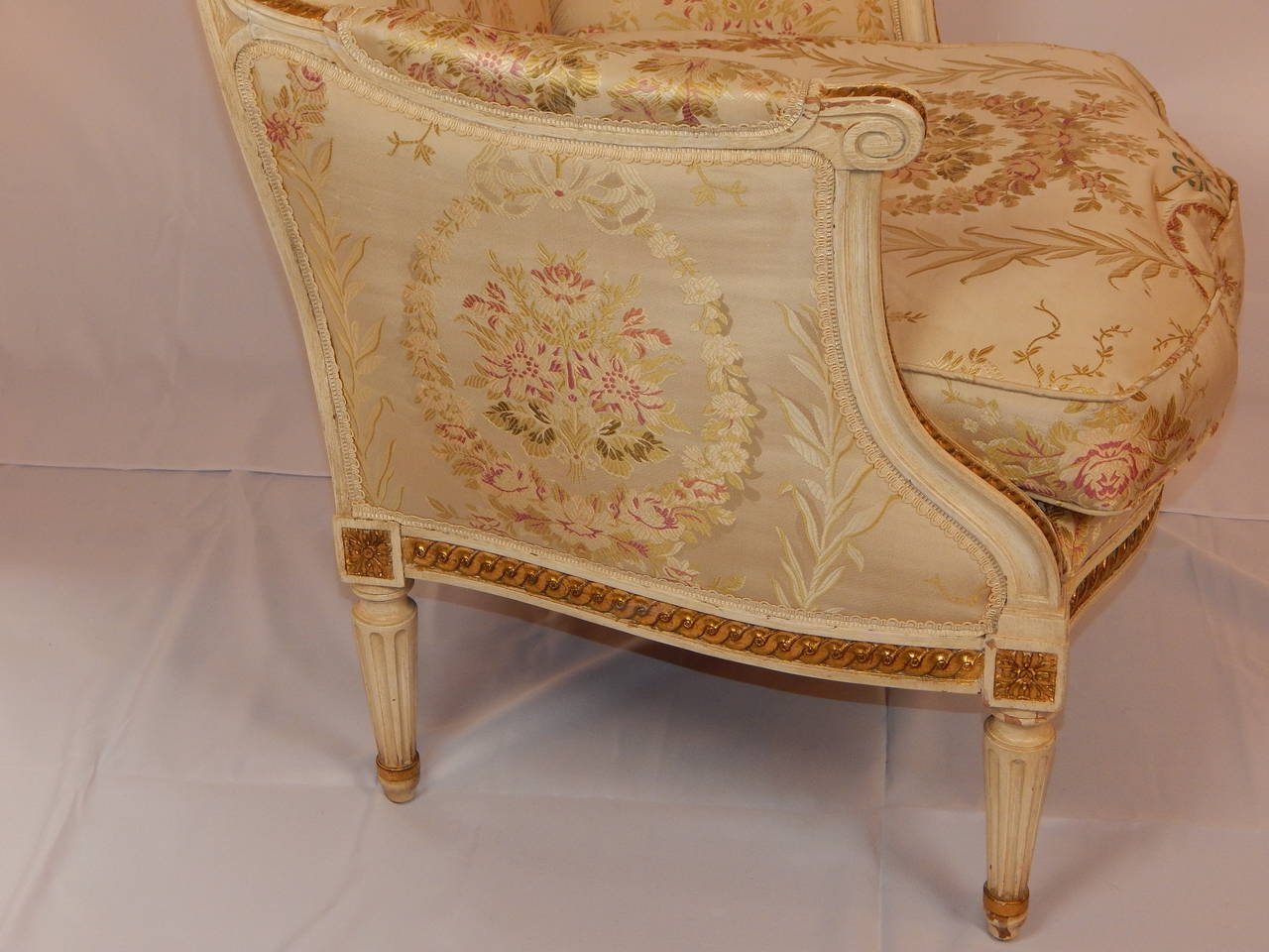 Wood Pair of Louis XVI Style Cream Painted Parcel-Gilt Bergère