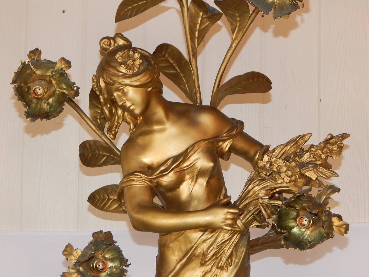 A beautiful gold painted spelter art nouveau style female figural lamp
signed Moreau.