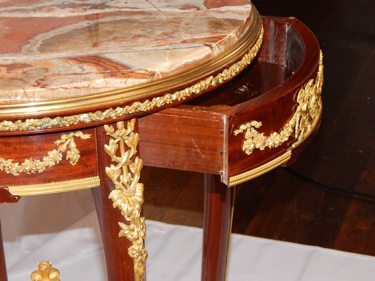 A very fine Louis XV style bronze-mounted side table, signed F. Linke, on the bronze rim, with a full stretcher and an exotic marble top.
The identical table is pictured in Christoper Payne's book, Francois Linke, The Belle Époque of French