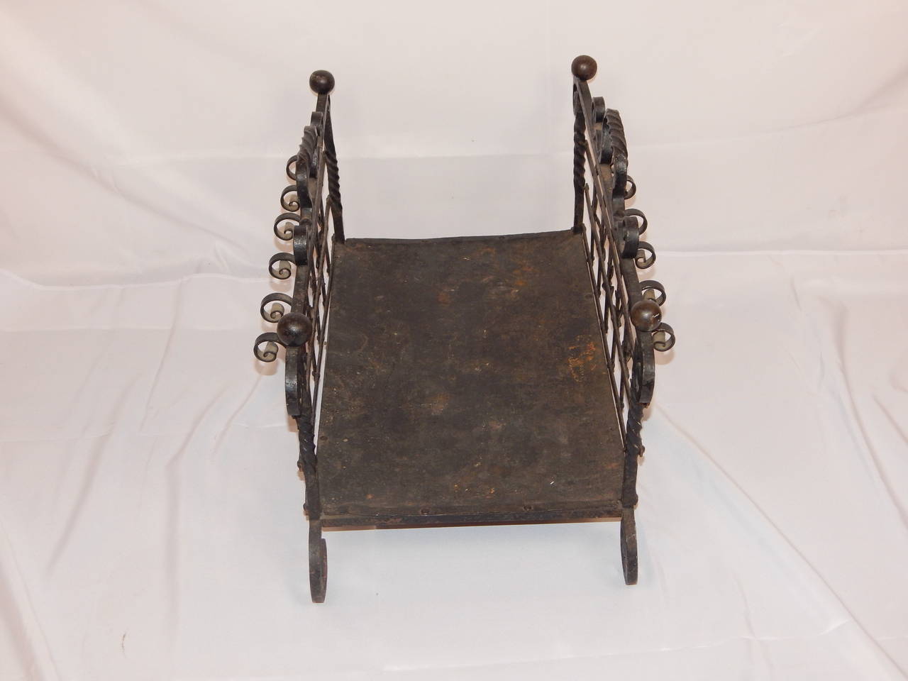 A wonderful antique wrought iron log or fire wood holder.