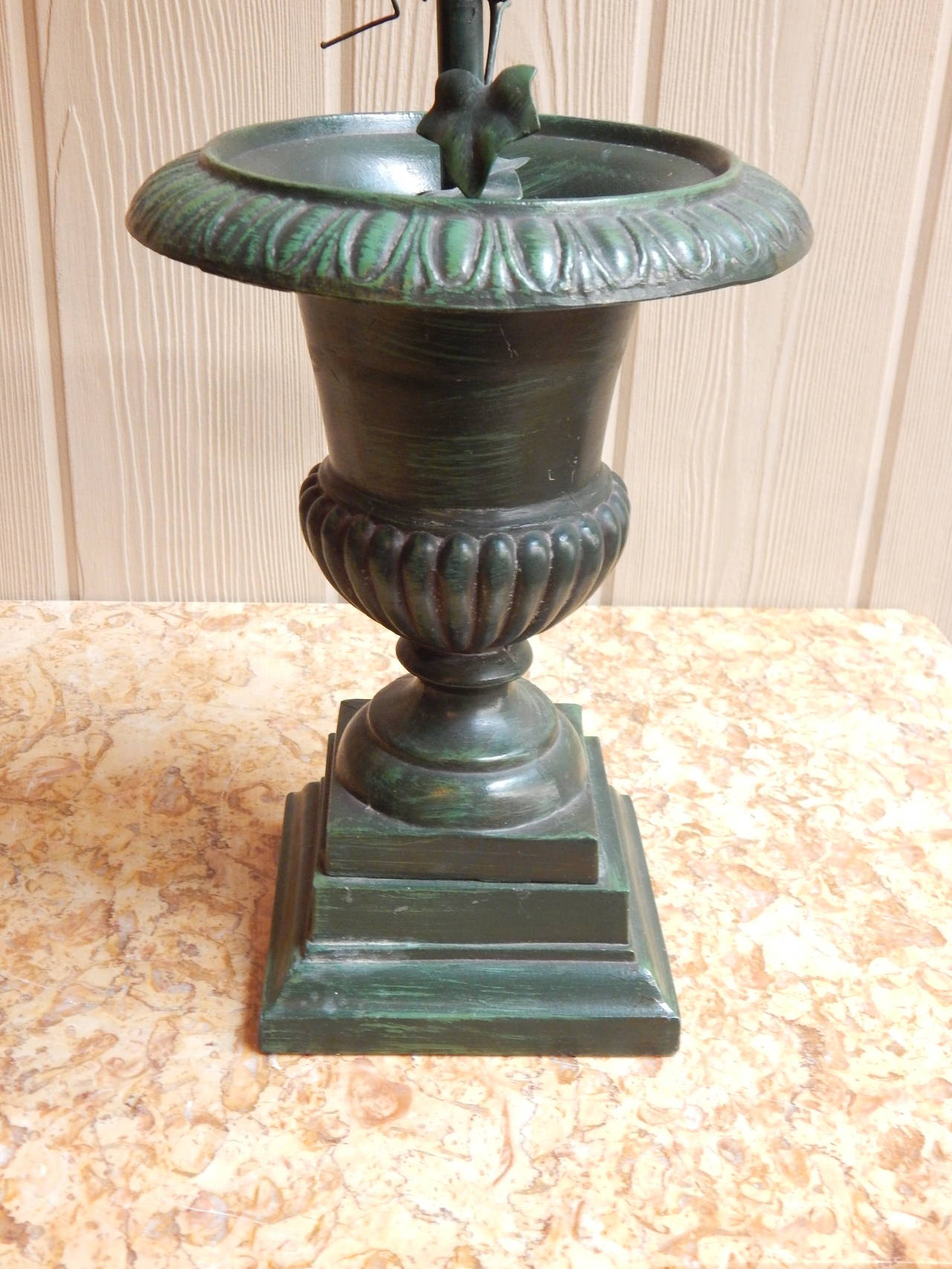 An unusual pair of green tole topiaries with glass vase inserts.
