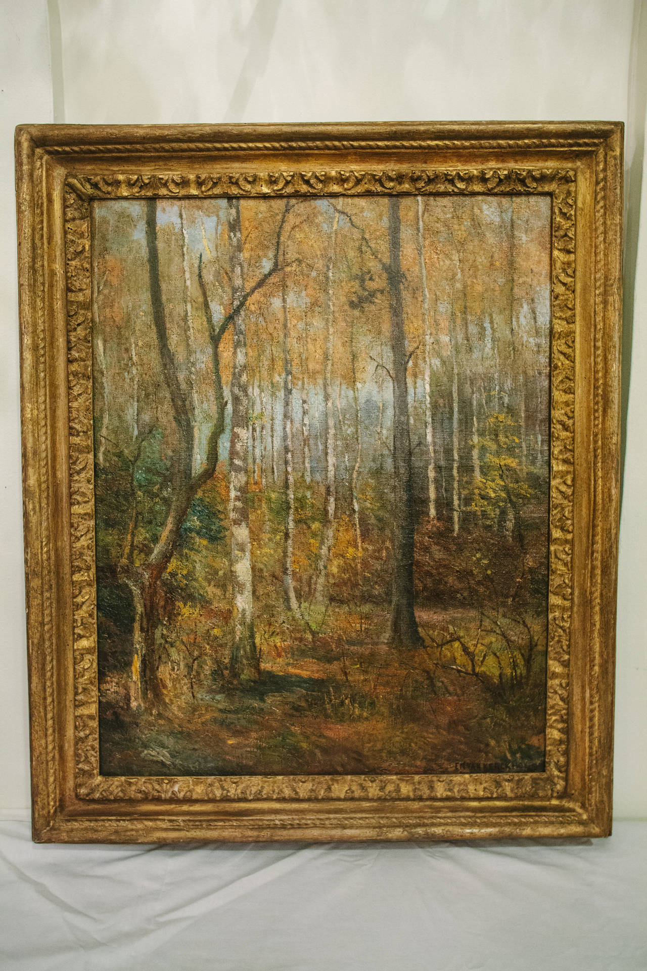Impressionistic oil on canvas of trees in original giltwood frame, circa 1910, signed, EmVan Kerckhoven, Belgium.