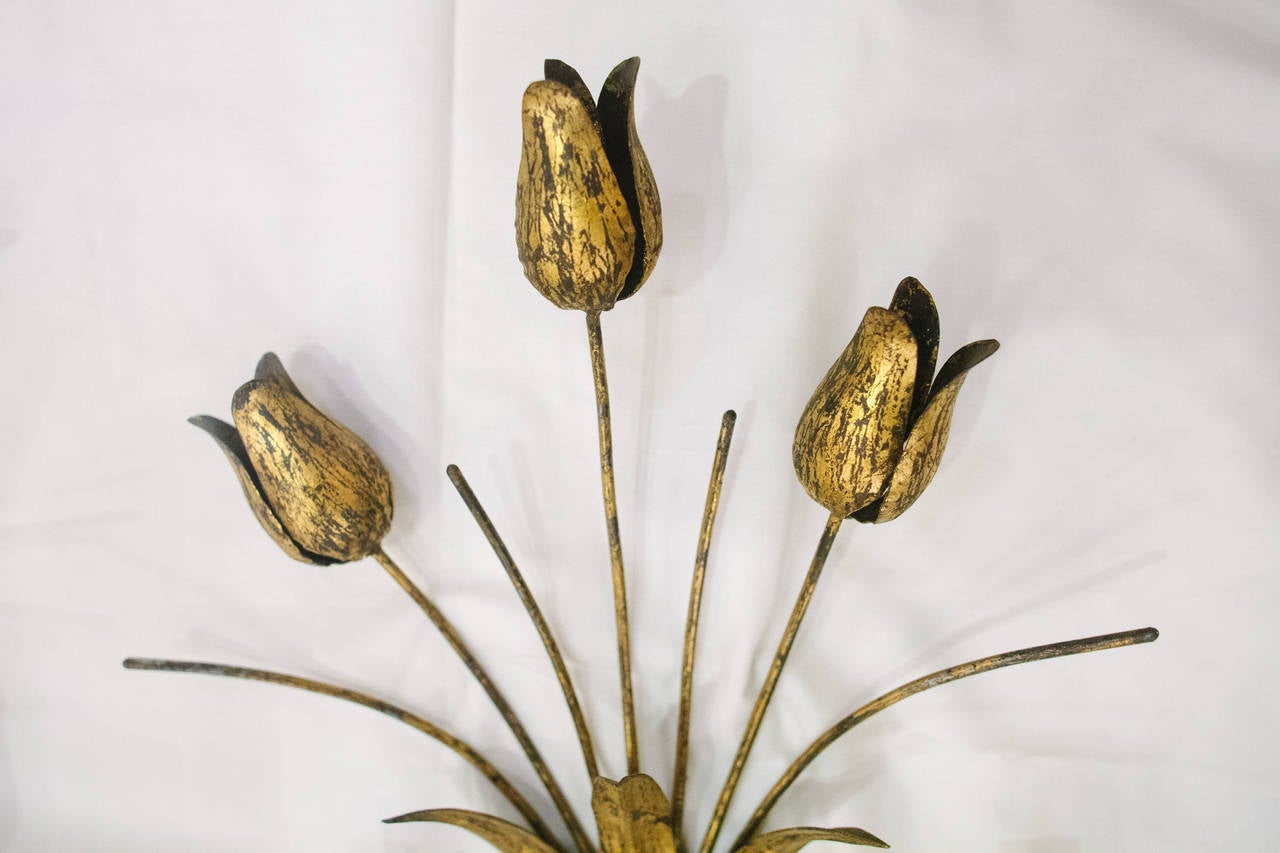 This set of four two-arm gilt metal sconces from Barcelona feature a tulip motif and have been newly rewired
