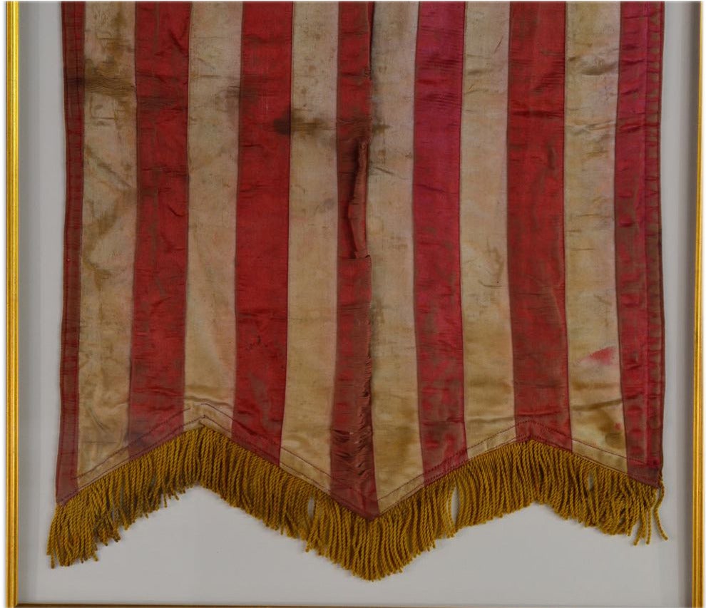 19th Century, 13 Star Patriotic Swallowtail Banner 

This exceptional 13 Star Patriotic Swallowtail Banner is large in detail and uniquely small in size for a typical banner of that period measuring at approximately 16 “x26”, framed 32”x40”; the