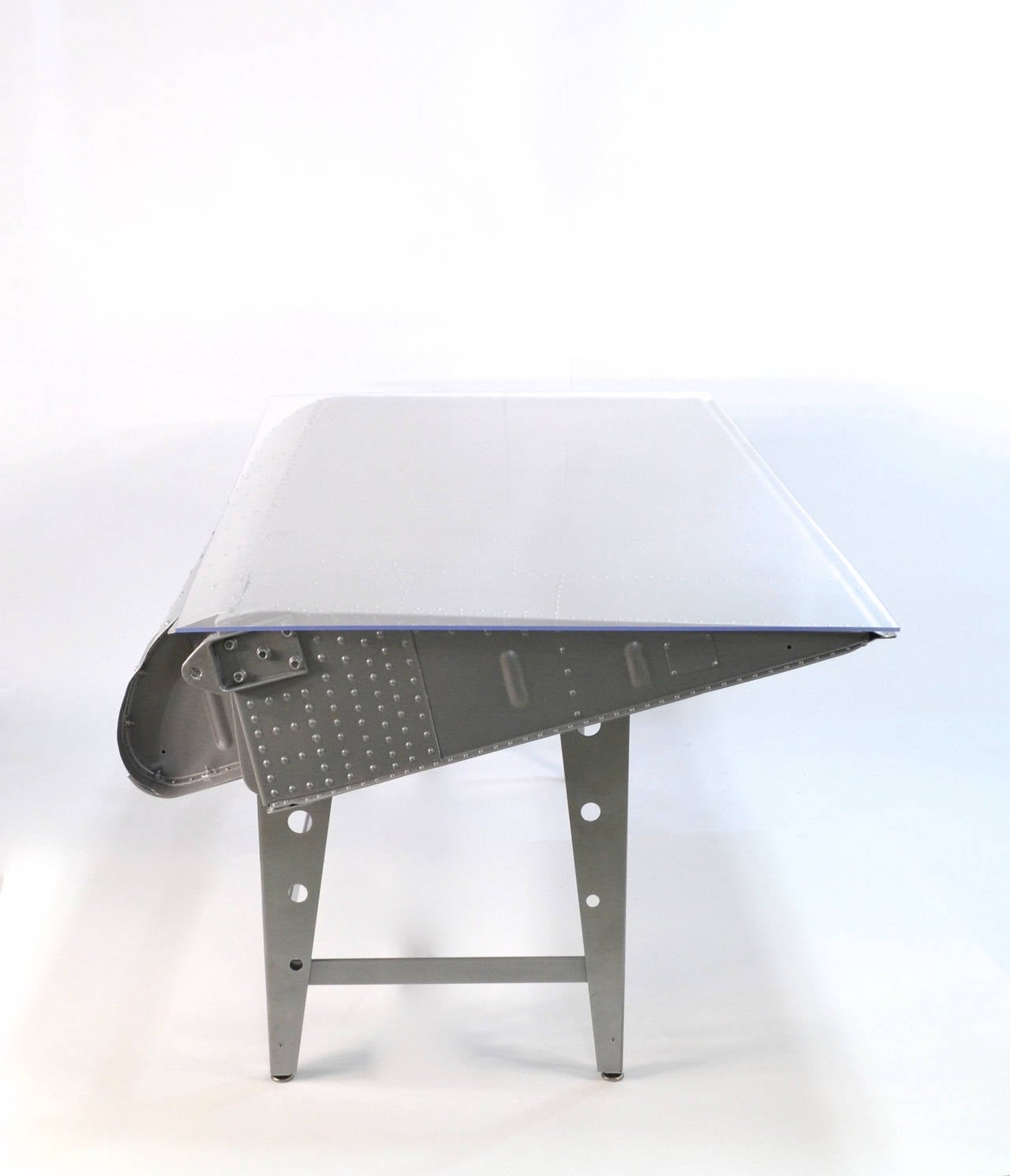 Rare opportunity to obtain a incredible Desk made from a section of wing from a WWII DC-3 US Army Air Corp military airplane.

The wings were recently found in a field where they have sat for almost 75 years. Its a miracle that they have not been