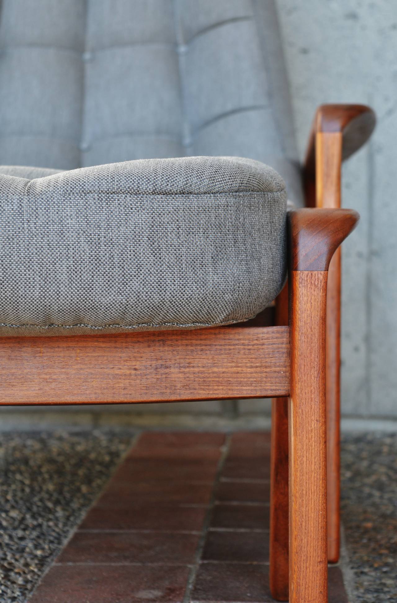 This is one of the most comfortable Danish Modern style teak frame lounge chairs ever! Manufactured by R. Huber & Company, Canada. Totally restored and reupholstered with new quality 25 year foam and a great grey tweed upholstery, this lovely