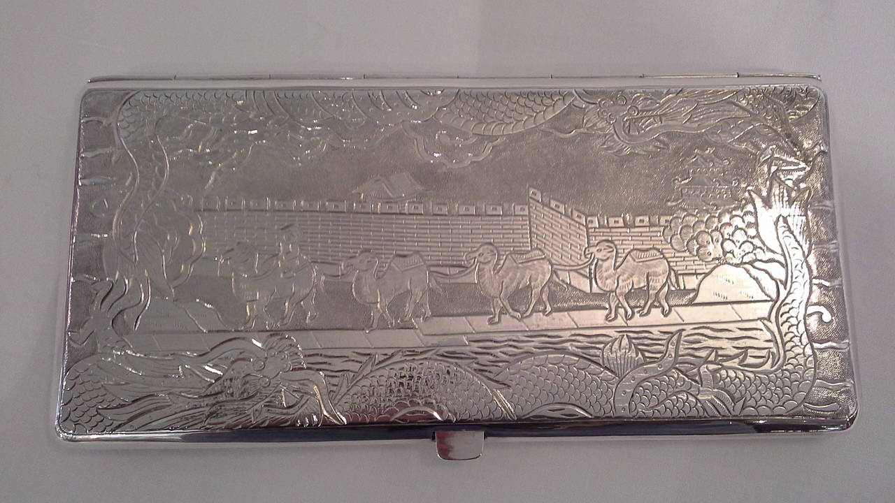 Sterling Silver Chinese Export Dragon Cigarette Case, Double dragons on the front, intialed in the center, the back is a scene of the Great Wall of China with a camel caravan leaving on expedition. The cigarette case weighs 240 grams and is stamped