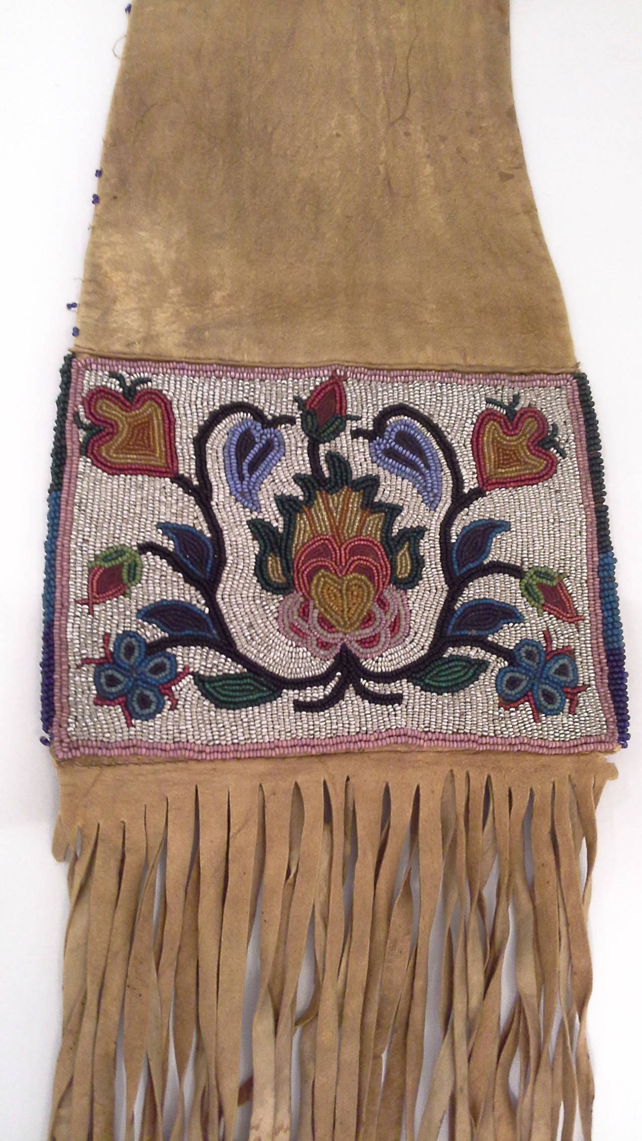 Native American Pipe Tobacco Bag With Floral Bead Work, Probably Ojibwa, Circa 1890-1920, Deer skin and colored bead work, floral decorated both sides depicting different floral patterns, side and top are done in dark blue beads with loss as per
