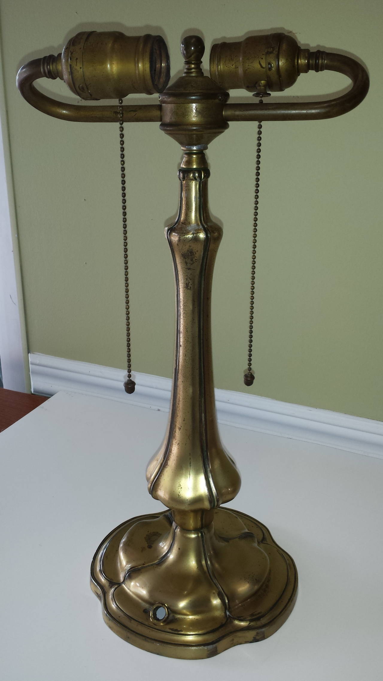 Pairpoint Table Lamp Base in an Antique Brass Finish with Double Sockets, The lamp is marked on the base Pairpoint Mfg. Co. with a Diamond and a P in center & Numbered B 3029, The lamp is 17"-inches high x 9"-inches wide, Both original