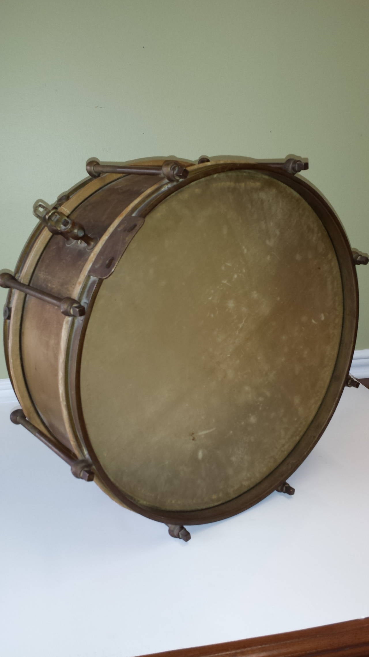All Brass Military or Marching Band Snare Drum, circa 1900, The drum is unmarked unless on the inside and has no other numbers or marks, Origin and affiliation unknown, It does have a neck or shoulder strap mount, it seems to vintage skins and