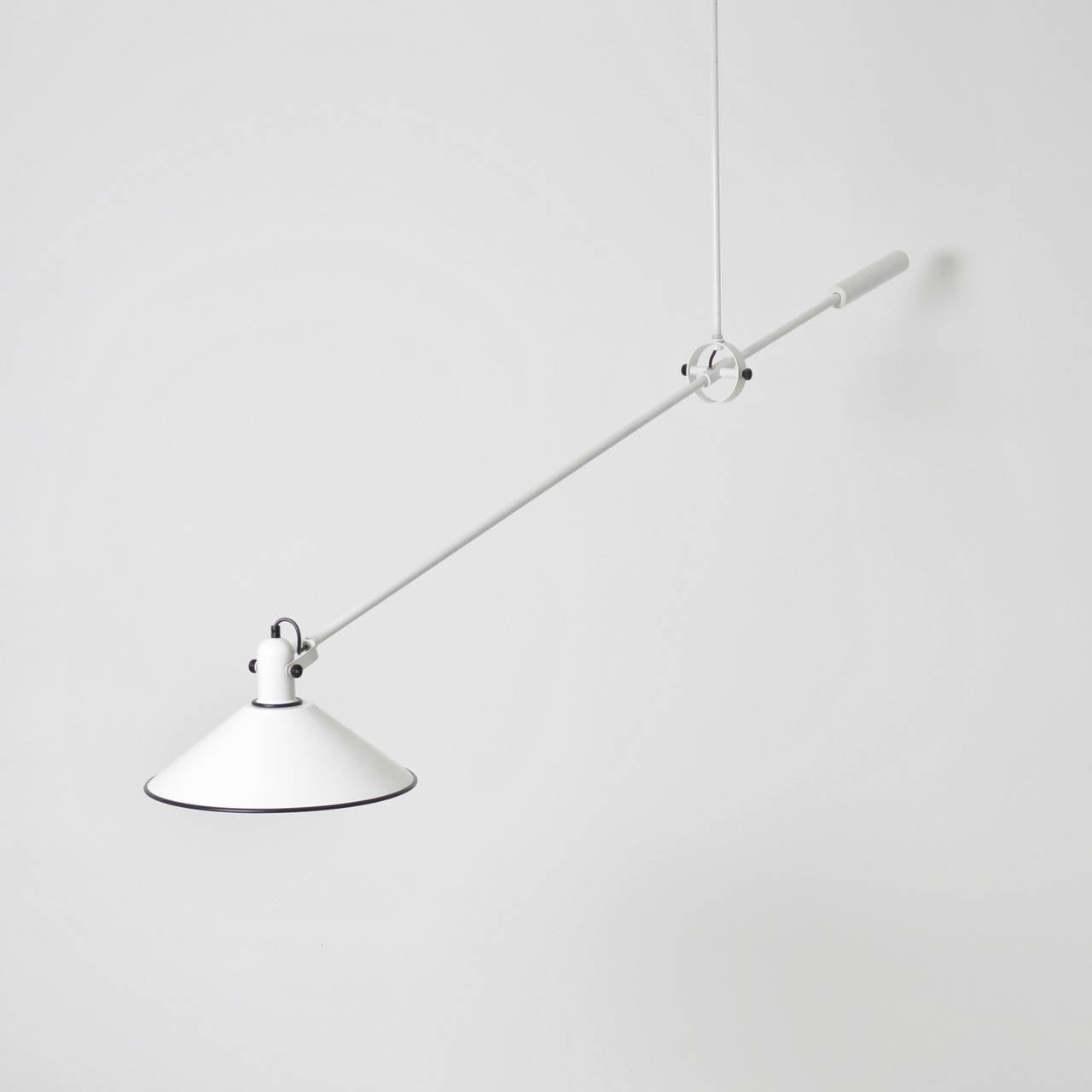 A sculptural counterbalanced ceiling lamp by one of the most respected Dutch lighting designers of the era, JJM Hoogervorst, principle designer for ANVIA, Holland. The weighted arm holds the position of the lamp. It is in excellent condition with