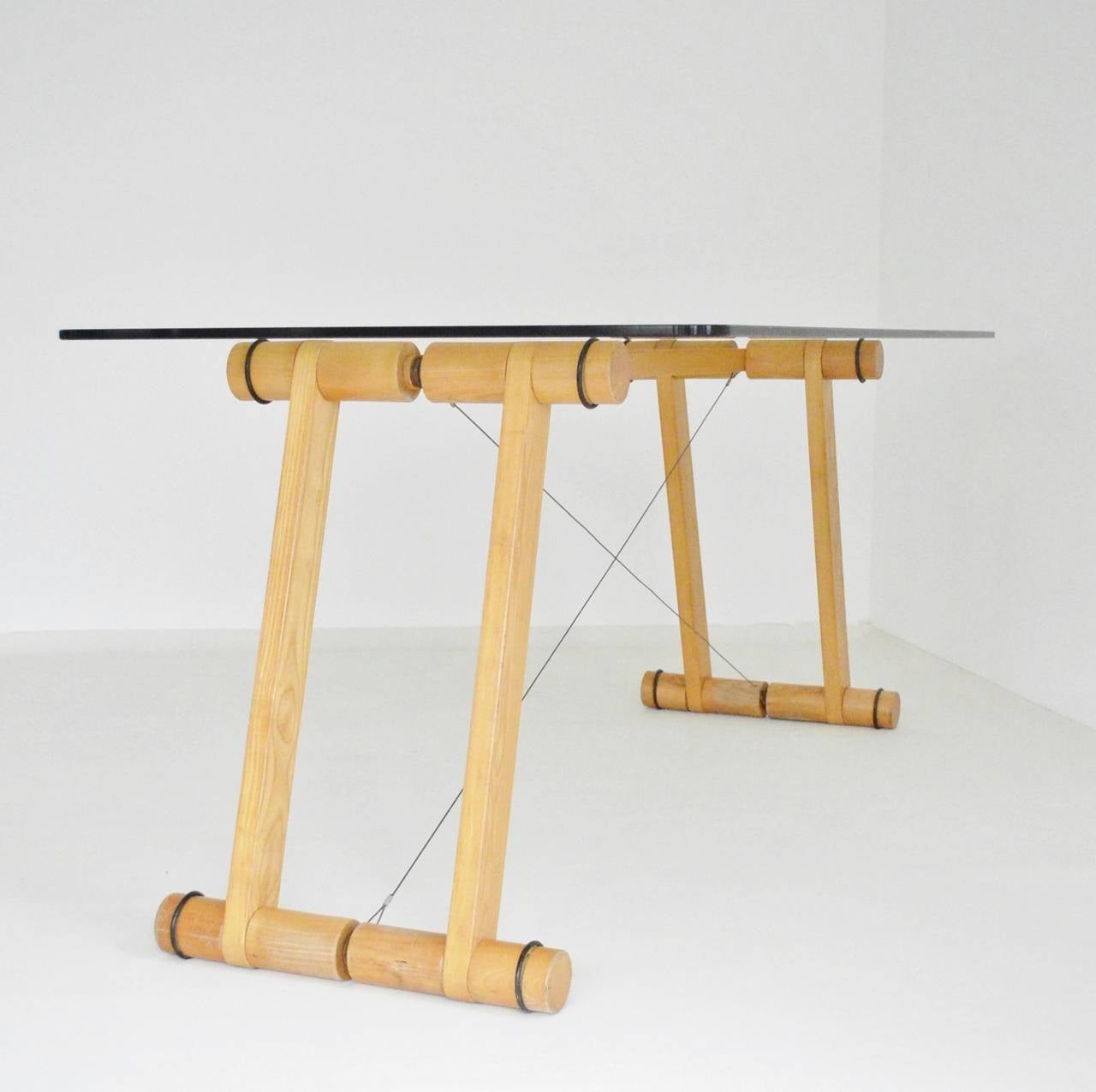 A pine framed and glass topped architects table braced with steel cable. Superstudio led the way for a group of Italian architects that had become disillusioned with modernist utopian principles which they believed had hit intellectual stasis by the
