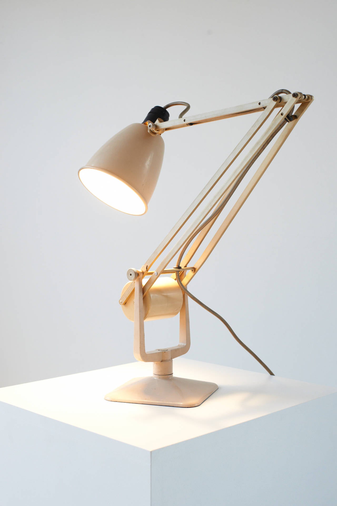 Altough there are similarities to Herbert Terry's iconic Anglepoise lamp this design predates it at in our opinion is more accomplished. An ingenious piece of industrial design, the rolling counterweight enables the lamp to hold its position without