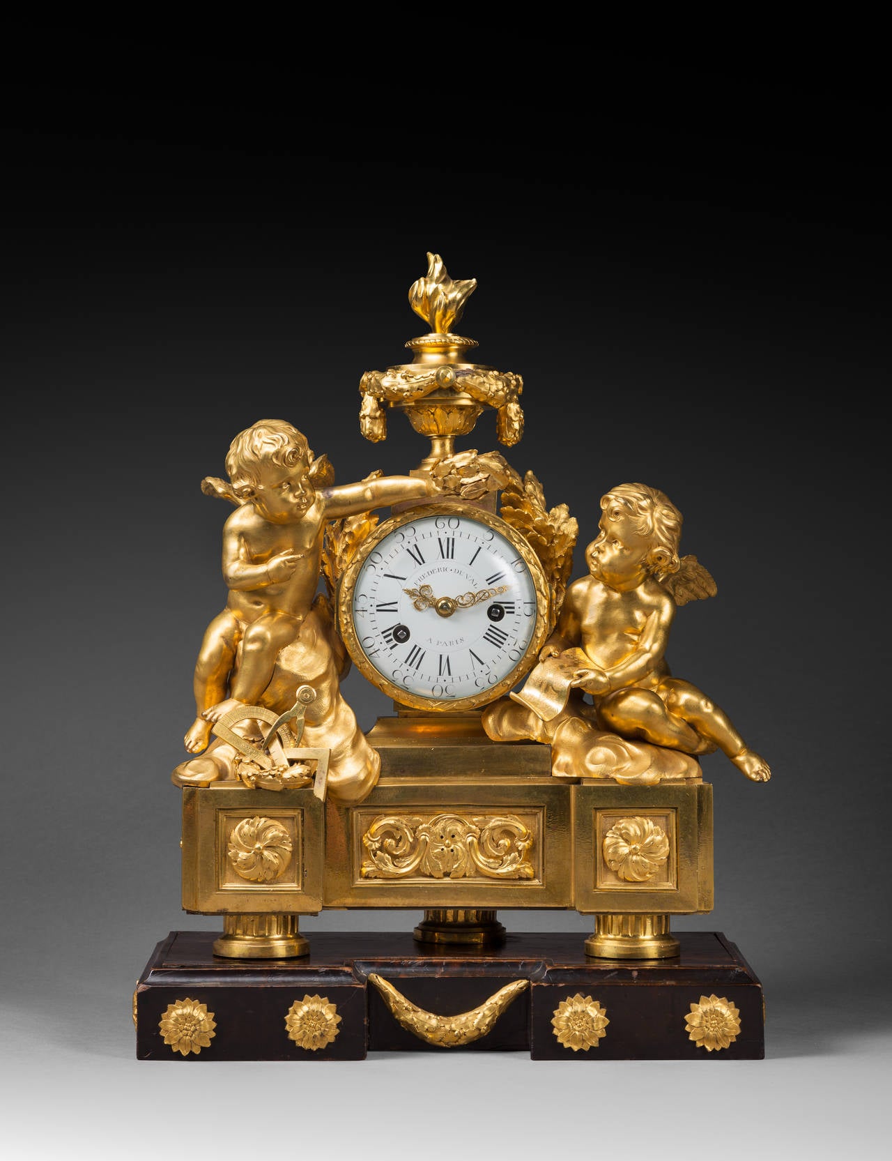 Frédéric Duval, Case Attributed to Jean-Joseph de Saint-Germain 

Rare Chased Gilt Bronze Neo-Classical Clock
Allegory of the Sciences

Paris, early Louis XVI period, circa 1775
Height 44 cm; width 37.5 cm; depth 14.5 cm
