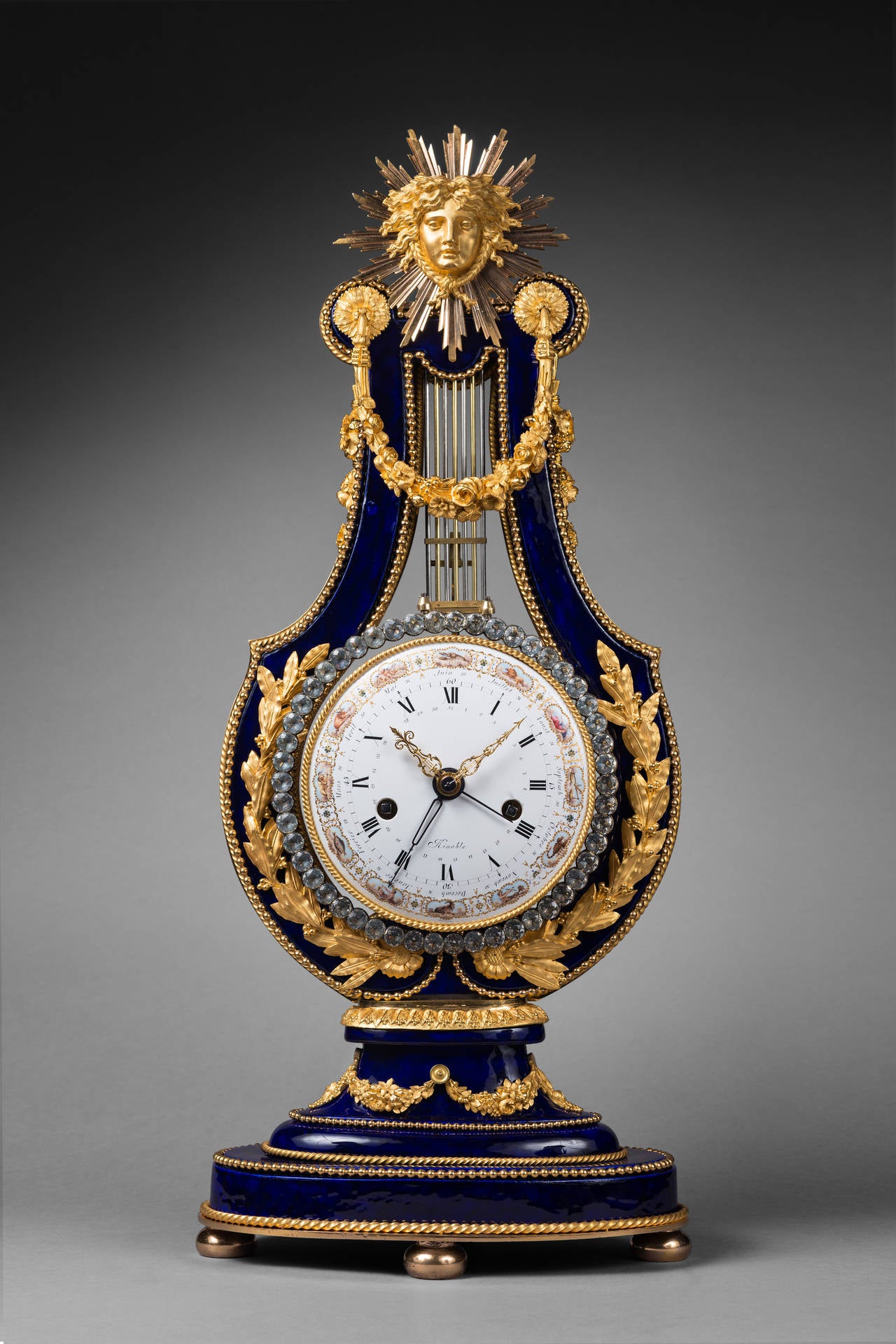 Dieudonné Kinable 

Enamel Dial Attributed to Dubuisson (1731-1815)

Exceptional Porcelain Lyre Mantel Clock from the Royal Sèvres Porcelain Manufactory

Paris, late Louis XVI period, circa 1785-1790 
Height 62 cm; width 26 cm; depth 16 cm