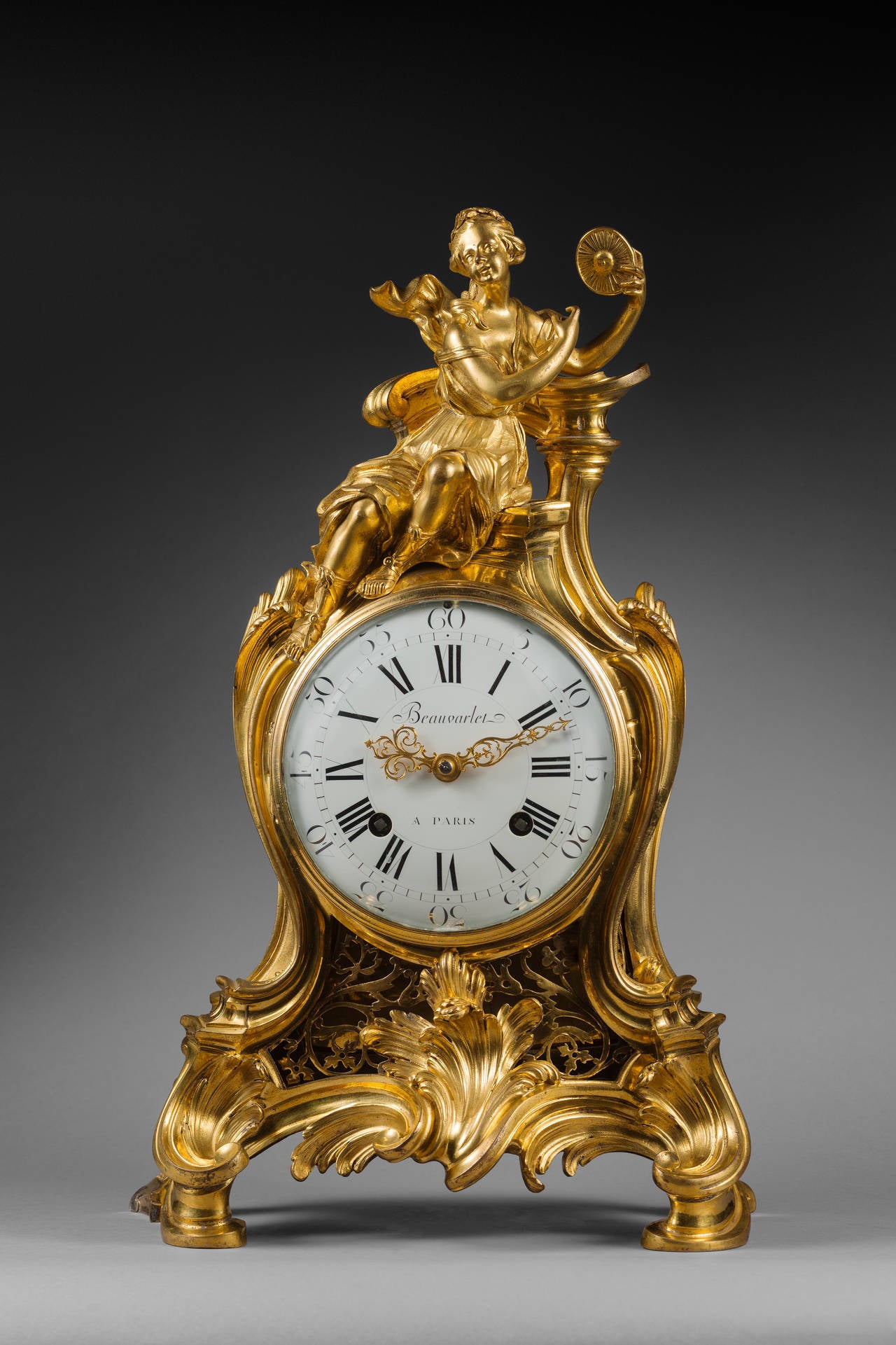 Louis-Antoine Beauvarlet 
Case Attributed to Jean-Joseph de Saint-Germain

Rare gilt bronze mantel clock 

Paris, Louis XV period, circa 1755-1760 
Height 52.5cm; width 34 cm; depth 19 cm 

The round enamel dial, signed “Beauvarlet a`