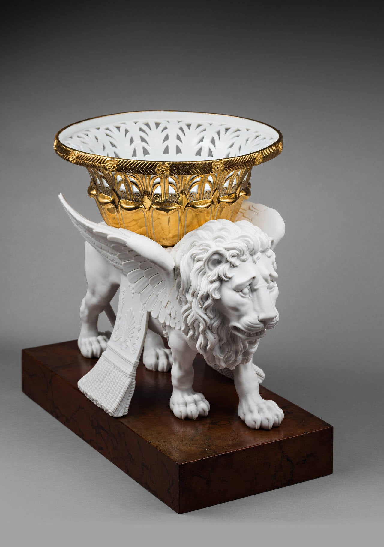 Pair of Sèvres Bisque Porcelain Winged Lions Bearing Gilt Baskets For Sale 2