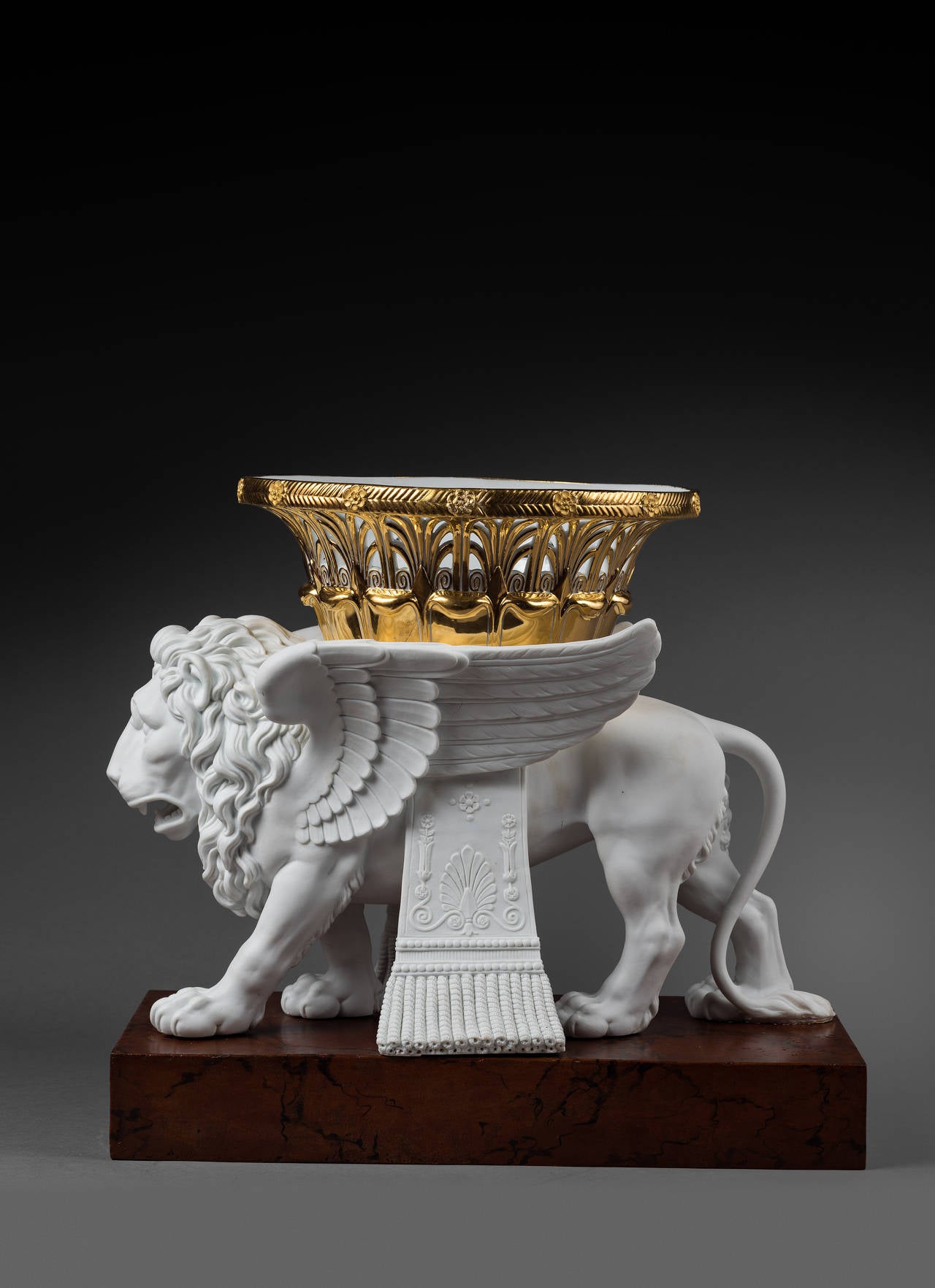 Pair of Sèvres Bisque Porcelain Winged Lions Bearing Gilt Baskets In Excellent Condition For Sale In Paris, FR