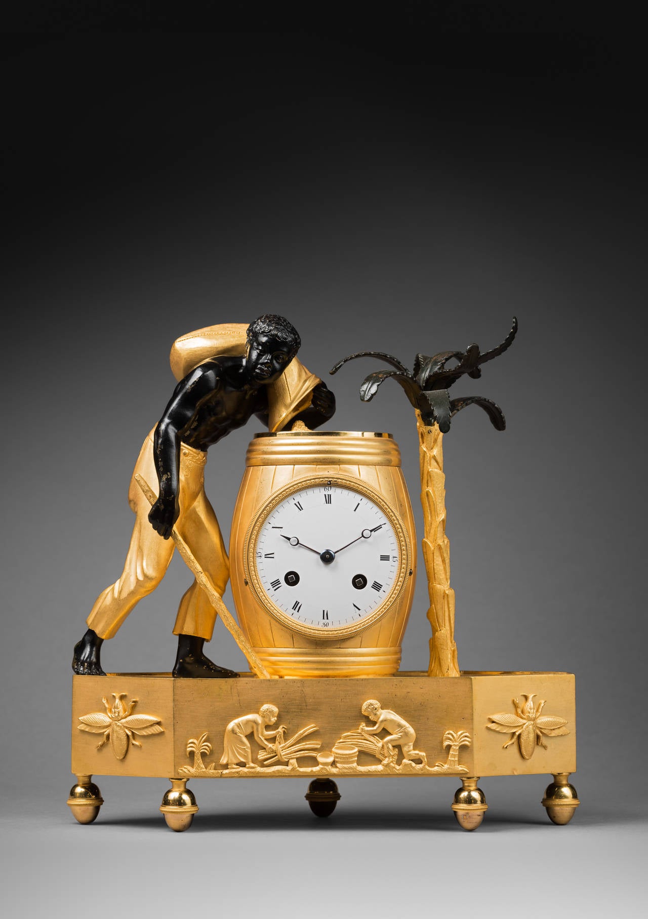 Model Attributed to Louis-Simon Deverberie.

Fine chased, gilt and patinated bronze mantel clock 
“The Coffee Bearer” 

Paris, Directoire period, circa 1795-1800. 
Dimensions: Height 29 cm; width 29 cm; depth 9.5 cm.

The round enamel dial