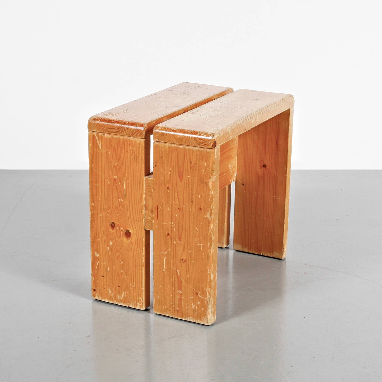 Stool designed by Charlotte Perriand for Les Arcs ski Resort around 1960, manufactured in France.
Pine wood.

In good original condition, with minor wear consistent with age and use, preserving a beautiful patina.

Charlotte Perriand (1903 -