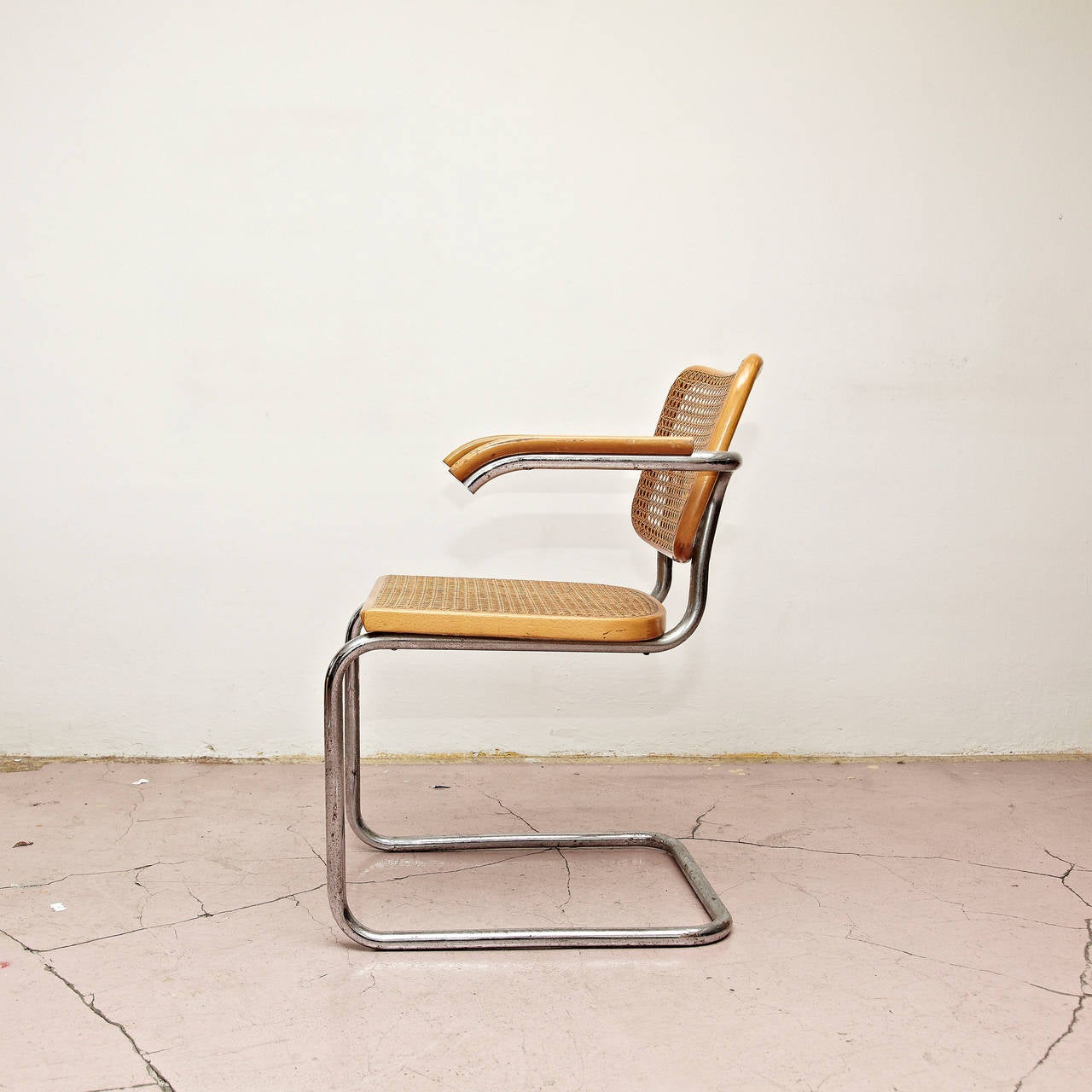 Chair, model Cesca, designed by Marcel Breuer around 1970, manufactured in Italy.
Metal pipe frame, wood seat and back structure and rattan.

 In good original condition, with minor wear consistent with age and use, preserving a beautiful