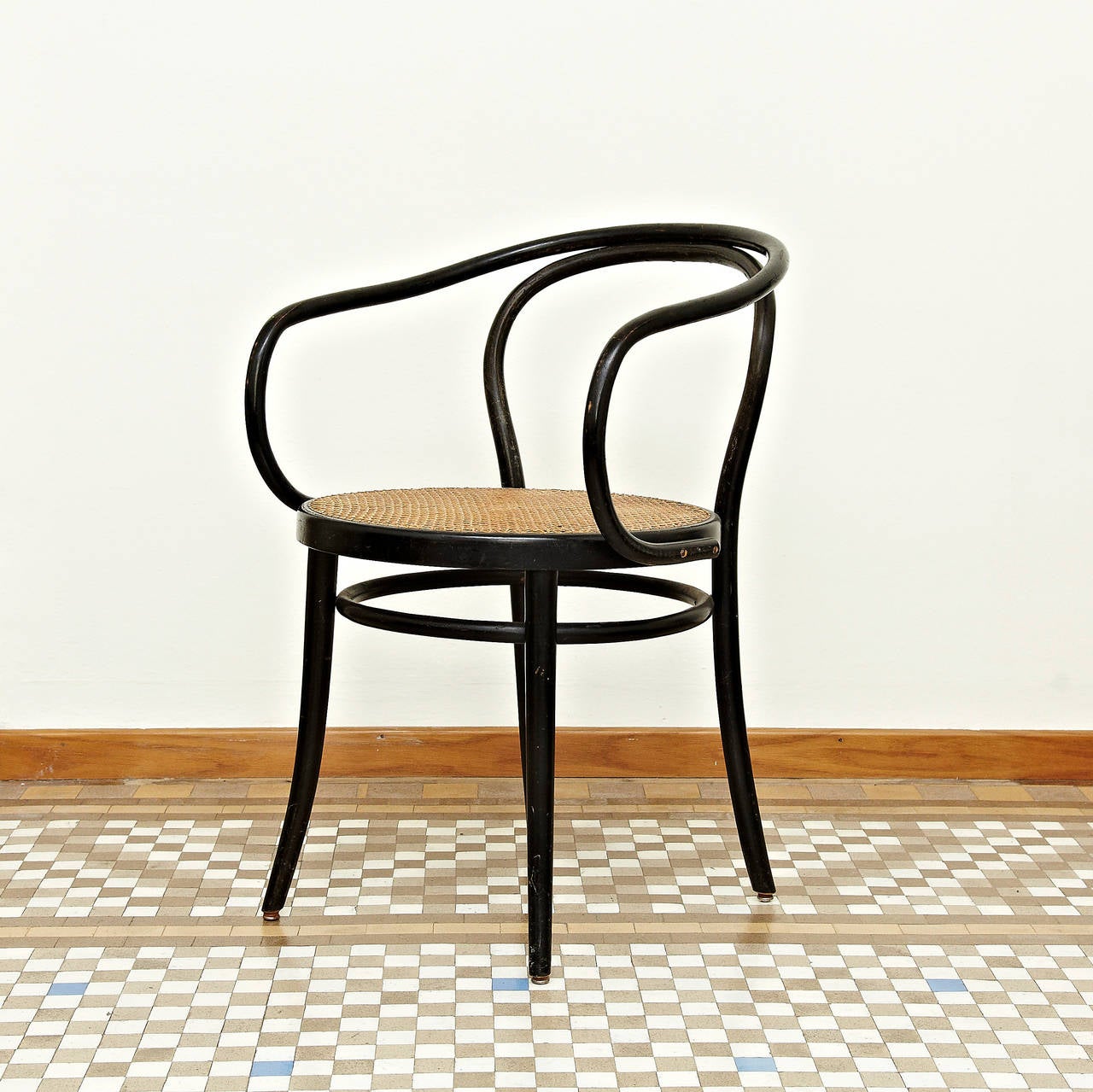 Set of Four Chairs, model 209 designed by Auguste Thonet, circa 1890. 
Manufactured by Thonet around 1950. 

Thonet 209 chair dates back to the beginning of the 20th century. The frame is made from a single item of solid black lacquered beech