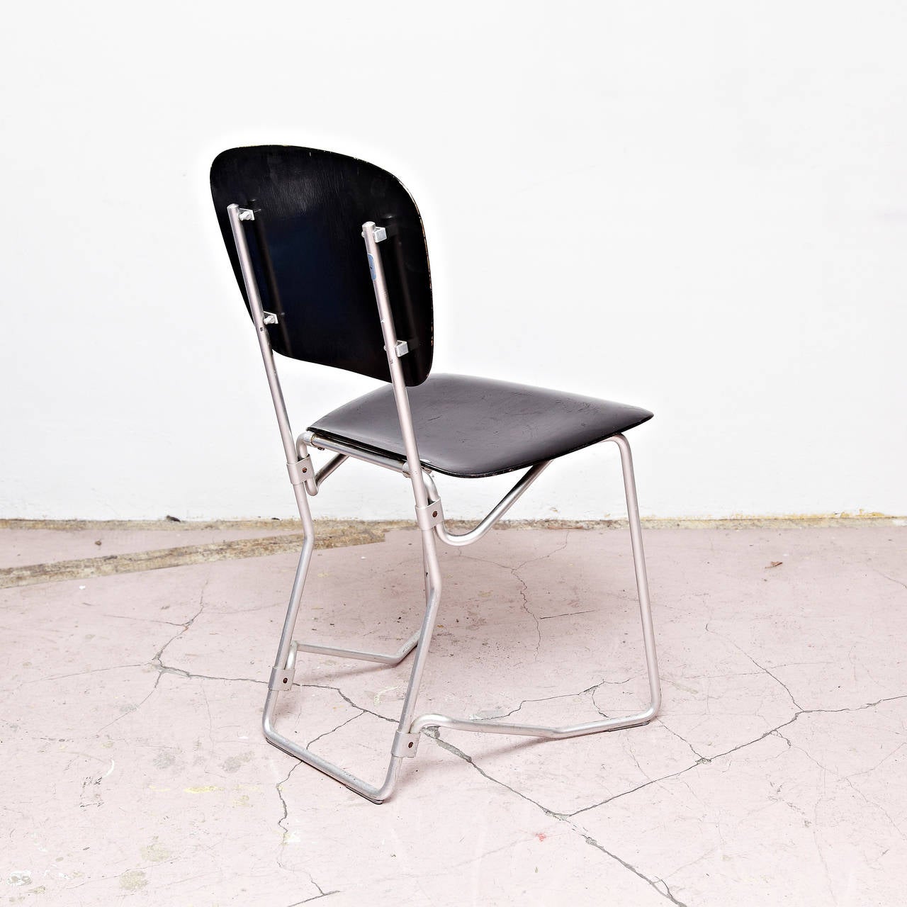 Stackable Aluflex chairs designed by Armin Wirth
Manufactured by Aluflex, Switzerland, circa 1950.  

In good original condition, with minor wear consistent with age and use, preserving a beautiful patina.

2 chairs available