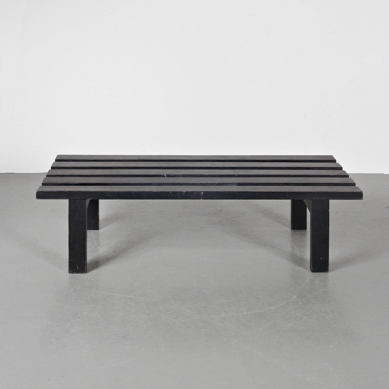 Bench designed by Martin Visser, manufactured in the Netherlands, circa 1950 by Spectrum.
Lacquered planks of wood in black. This is the short version.

Preserves the original label to the underside.

In good original condition, with minor wear
