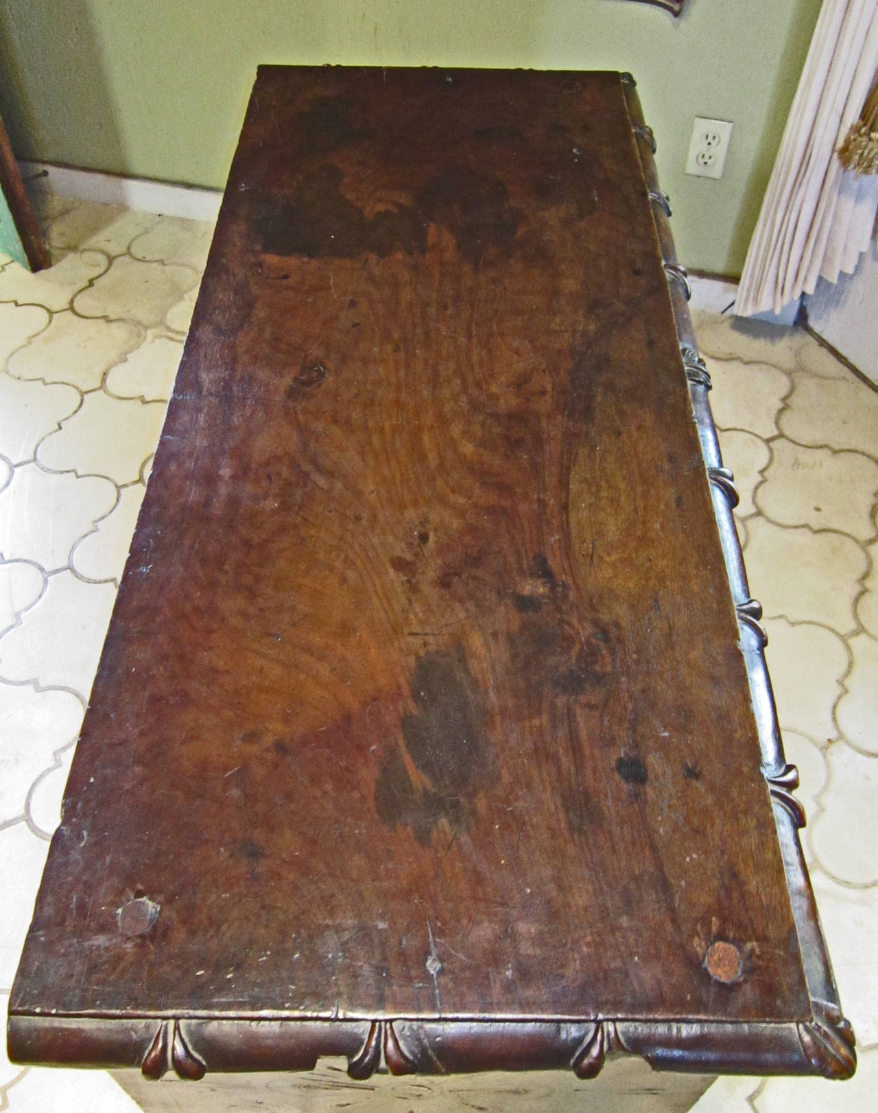 This very old piece is typical of the marquetry work done in the Mexican state of Oaxaca in the late 17th century early 18th C.  It shows it's age beautifully on the outside, a rich patina that Mesquite wood develops with time due to it's extreme