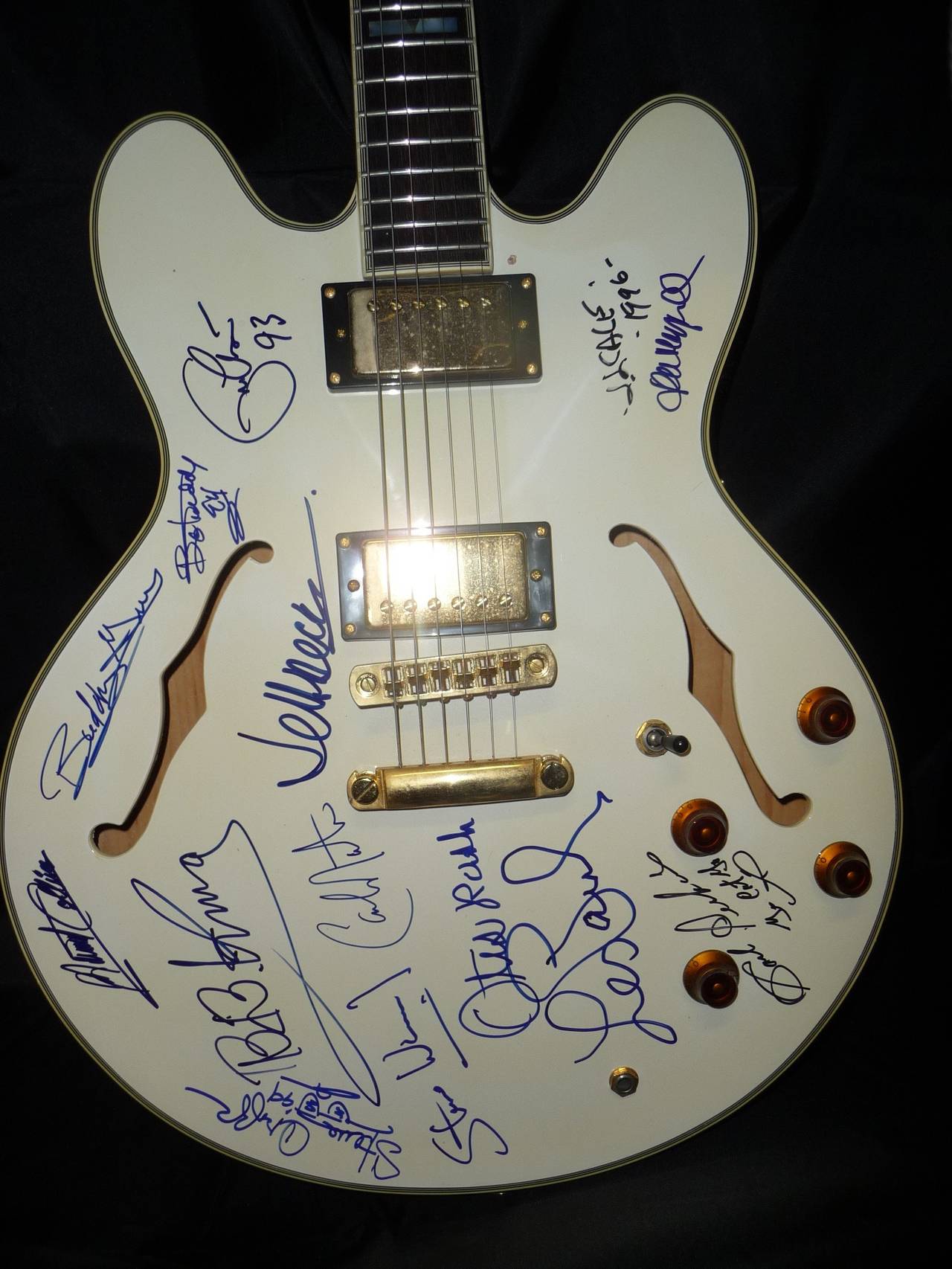 This is an Epiphone Sheraton guitar c. 1992 signed by music legends Albert Collins, Buddy Guy, Bo Diddly, Eric Clapton, JJ Cale, John Mayall, Carl Perkins, Les Paul, Otis Rush, Steve Winwood, Carlos Santana, Jeff Beck, Steve Cropper, and BB King. 