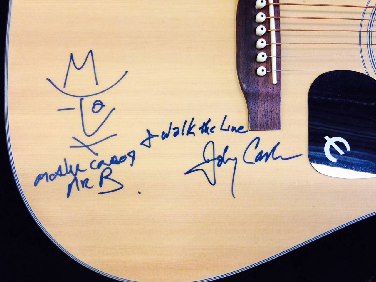 This is a Gibson Epiphone guitar circa 1992 signed in 1994 by the great Johnny Cash, famous for the song, 