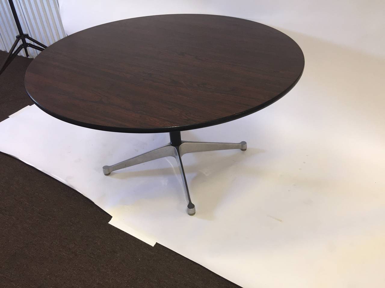 This is a pair of Charles Eames designed for Herman Miller round top tables with an X aluminum base. The tops are rosewood laminate in nice shape circa 1970s-1980s. Perfect for a dining table in a modern space.
Can be purchased separately at