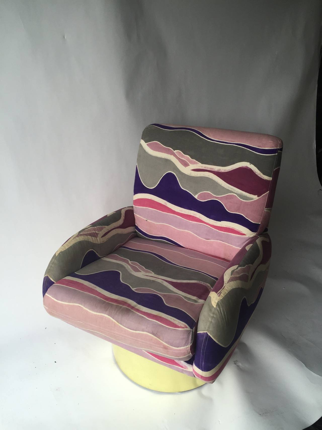 Great swivel chair designed by Milo Baughman with original colorful fabric
and round polished brass base designed,
circa 1970s.